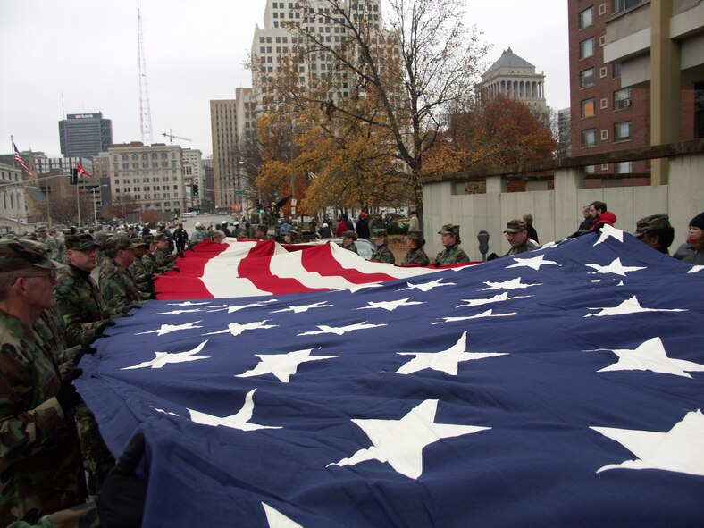 SALUTE to all the nation's veterans:  
The 932nd Airlift Wing at Scott Air Force Base honors veterans by marching the American flag through the streets of Saint Louis.  The wing is an Air Force Reserve Command unit made up of approximately 1,000 Reservists.  Photo/Capt. Stan Paregien