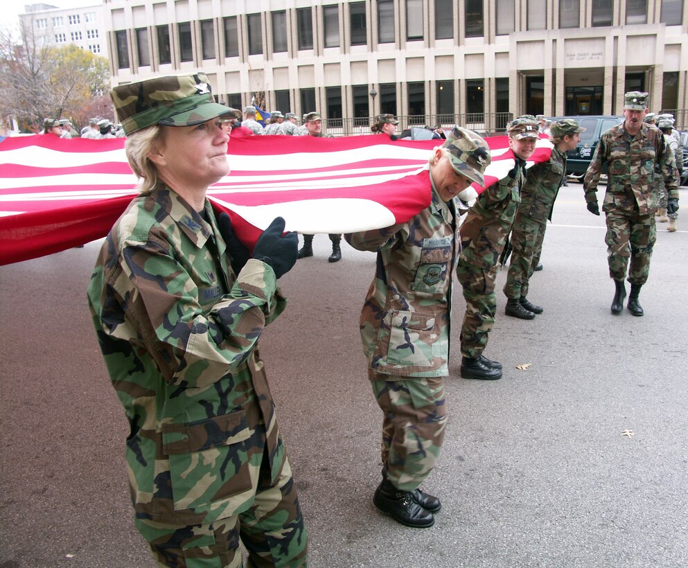 The commander of the 932nd Airlift Wing at Scott Air Force Base, Col. Maryanne Miller, looks ahead to the start of the 23rd annual St. Louis Veteran's Day parade.  The wing helped honor veterans by marching the American flag through the streets while children and adults watched and clapped.  The wing is an Air Force Reserve Command unit made up of approximately 1,000 Reservists.  Photo/Capt. Stan Paregien