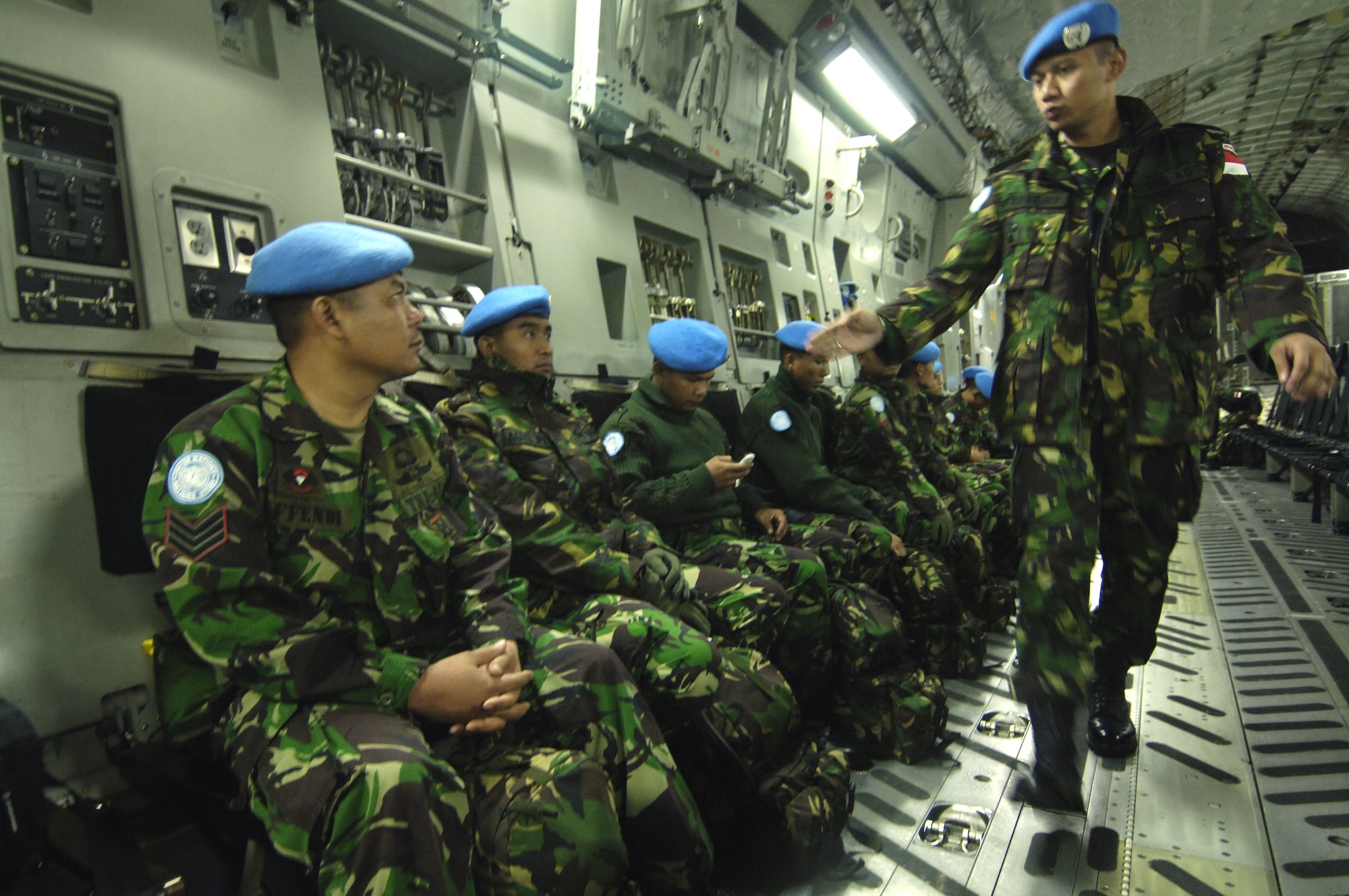 Indonesian peacekeeping troops get situated onboard a C-17 Globemaster III Nov.8 prior to takeoff.  They are deploying to Lebanon in support of UNIFIL, the United Nation's Interim Force in Lebanon.  (U.S. Air Force photo/Tech. Sgt. John M. Foster)