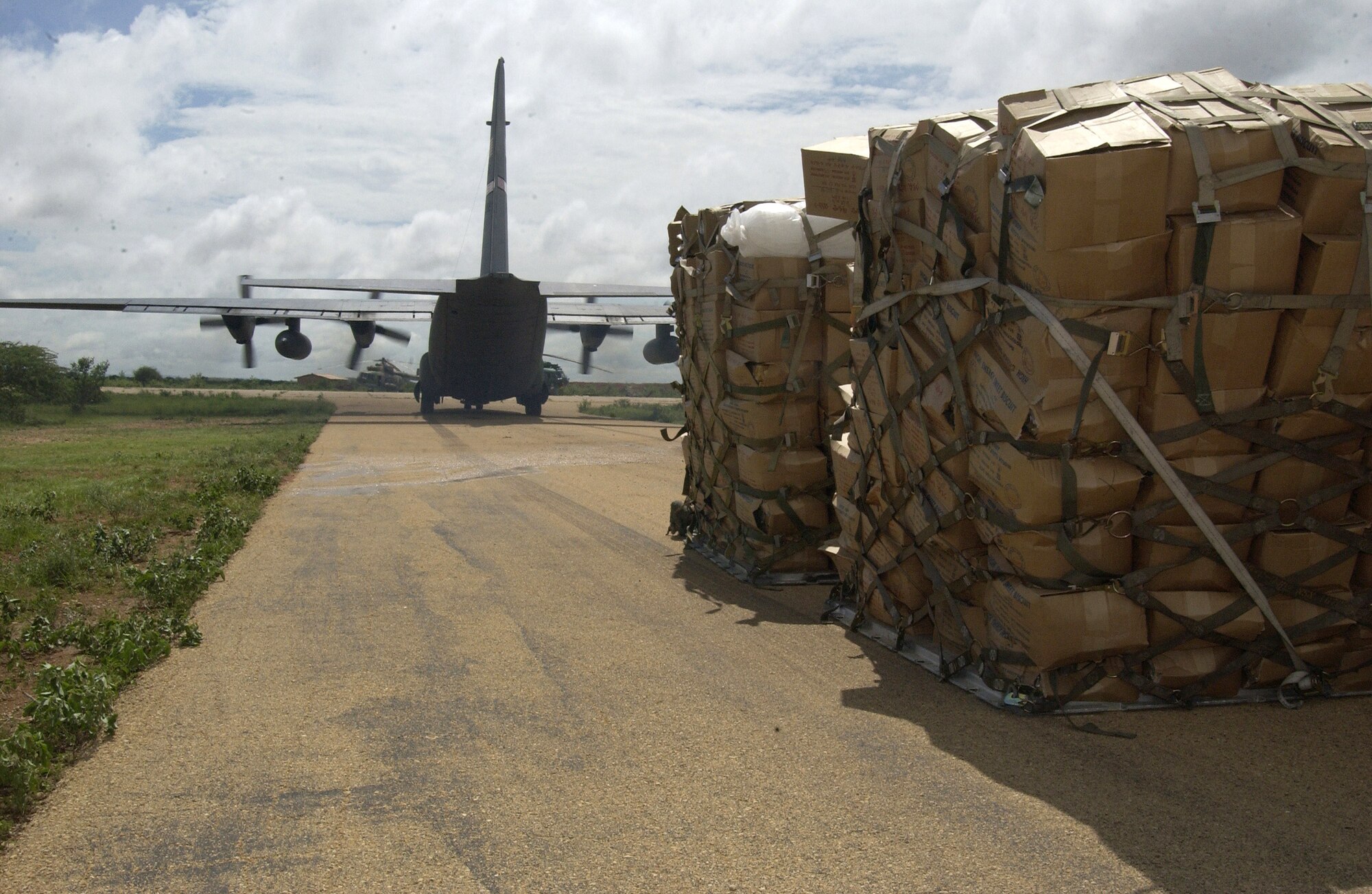 A C-130H Hercules aircraft assigned to Combined Joint Task Force - Horn of Africa delivered humanitarian aid to flood victims in the Ogaden region of Ethiopia Nov. 10. (U.S. Navy photo/Master Chief Petty Officer Philip A. Fortnam) 

