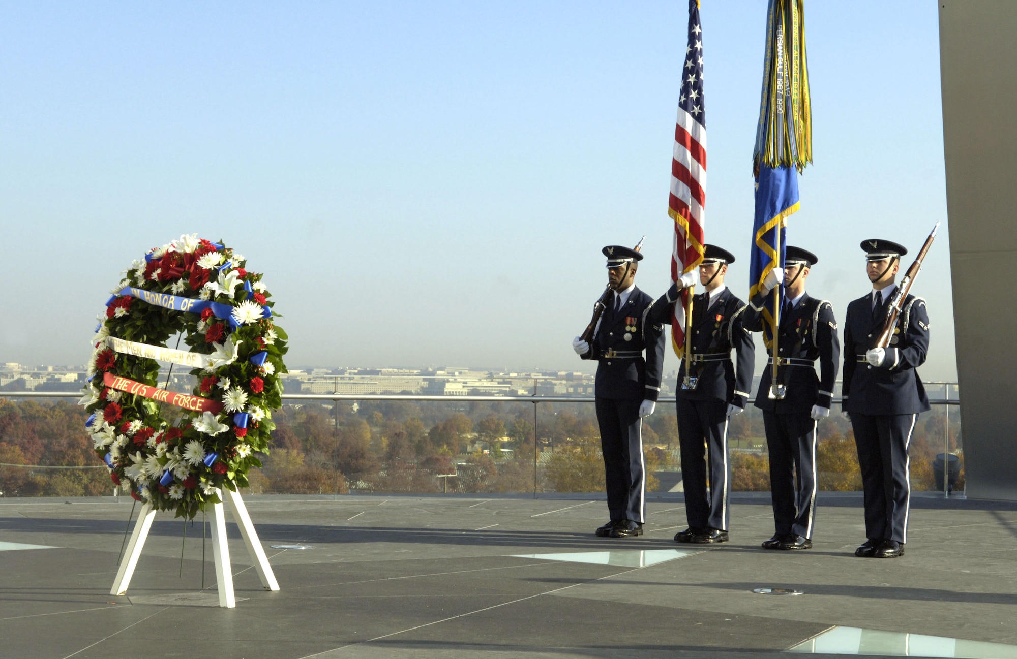 Color Guard members from Bolling Air Force Base stand at attention at the conclusion of a wreath presentation by Doolittle's Raiders at the Air Force Memorial on Nov. 10, in Arlington, Va. The wreath was placed at the base of the Air Force Memorial in rememberance of fallen Air Force members from the past and present. (U.S. Air Force photo/Tech. Sgt. Cohen Young)