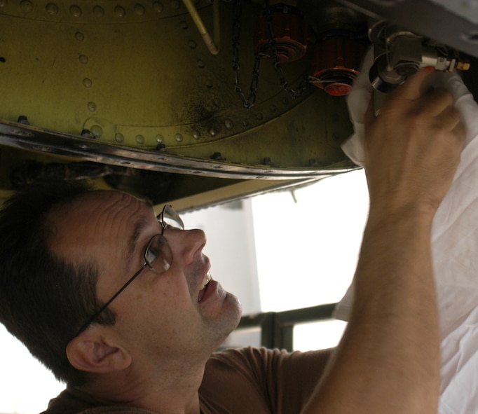 Tech. Sgt. David Frith changes the left hydraulic pressure return filters on A-10 Thunderbolt II, number 201, belonging to the 442nd Fighter Wing at Whiteman Air Force Base, Mo., Nov. 5, 2006.  Sergean Firth is a hydraulics specialist and Air Force Reservist.  Checking the hydraulic seals and filters is an important maintenance item on aircraft recently returned from the 442nd FW's deployment to Afghanistan.  (U.S. Air Force photo/Maj. David Kurle)  