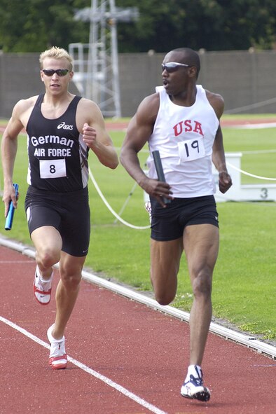 Senior Airman Lynn Stewart, 7th Component Maintenance Squadron, right, takes first place over Germany in the 4x400-meter relay at the the Air North Track and Field Championships in London in 2006.                     