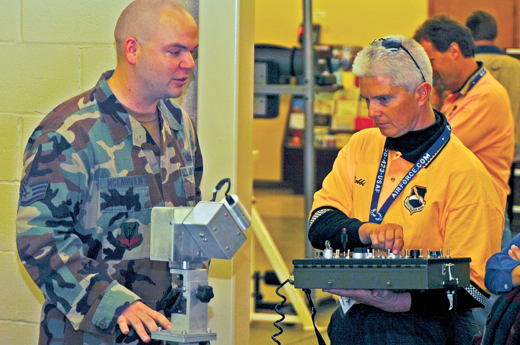 Staff Sgt. David McLaughlin, 4th Explosive Ordnance Disposal flight, explains how remote control robots are used for reconnaissance and removal of improvised explosive devices in Iraq to fight the Global War on Terrorism. Thrity-five civic leaders from Tyndall Air Force Base toured the base Nov. 3 to learn how the 4th Fighter Wing applies current technology to maintain our focus on GWOT and ensure the safety of our nation.  (U.S. Air Force photo by Airman 1st Class Greg Biondo)
