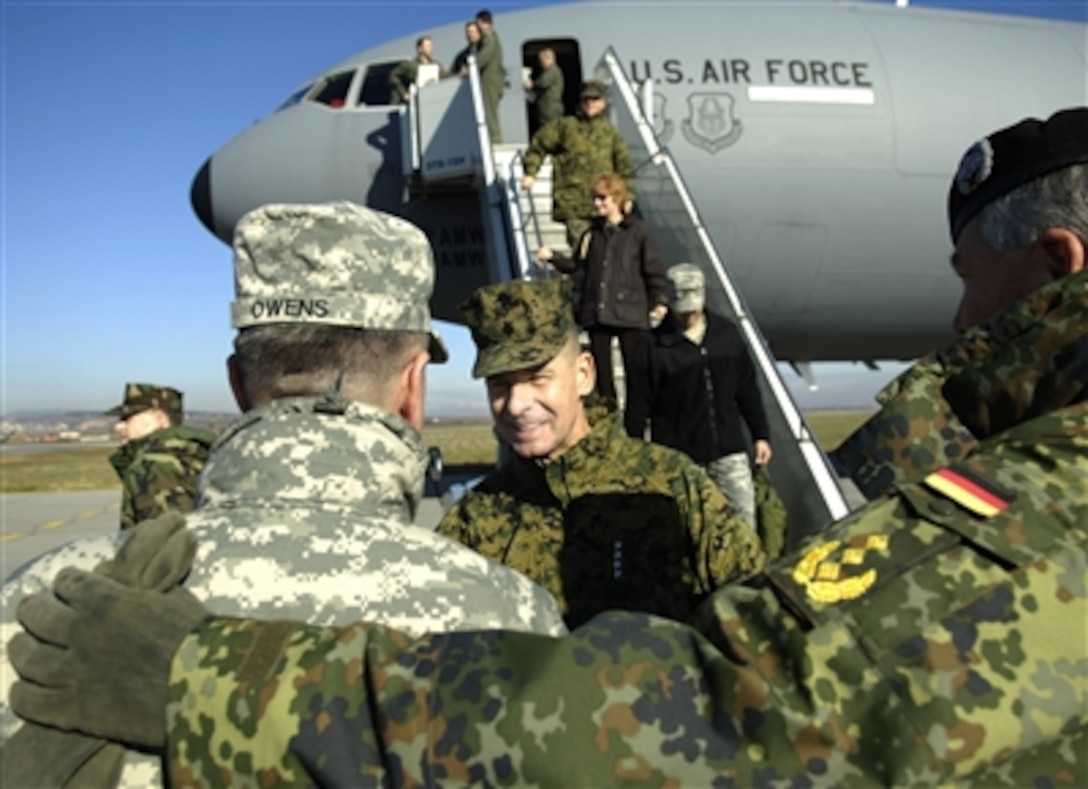 Chairman of the Joint Chiefs of Staff Gen. Peter Pace, U.S. Marine Corps, is introduced to Brig Gen. Darren Owens by German Lt. Gen. Roland Kather, commander of Kosovo Forces, as he arrives at Saltina Airfield in Kosovo on Nov. 14, 2006.  Pace is to meet with Owens and Kather to discuss the NATO mission in Kosovo and will conduct a town hall meeting with U.S. troops at Camp Bondsteel.  