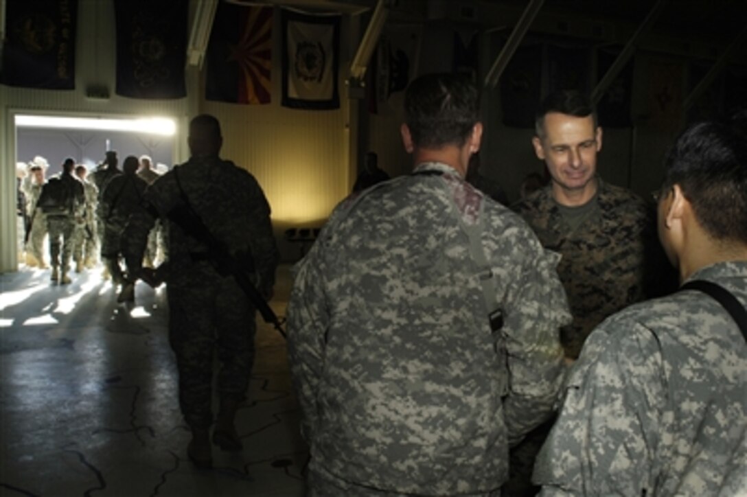 Chairman of the Joint Chiefs of Staff U.S. Marine Gen. Peter Pace greets soldiers at the conclusion of a town hall meeting in Camp Bondsteel, Kosovo, Nov. 14, 2006. Pace addressed questions from the soldiers. 