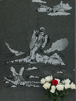 The granite memorial to the crew of King 56 includes an image of a C-130 flying overhead with a pararescueman being lowered to assist an injured servciemember on one side.  The other side contains an inscription describing the tragedy that occurred Nov. 22, 1996 when a C-130 aircraft crashed with 10 Portland-based Airmen on board.