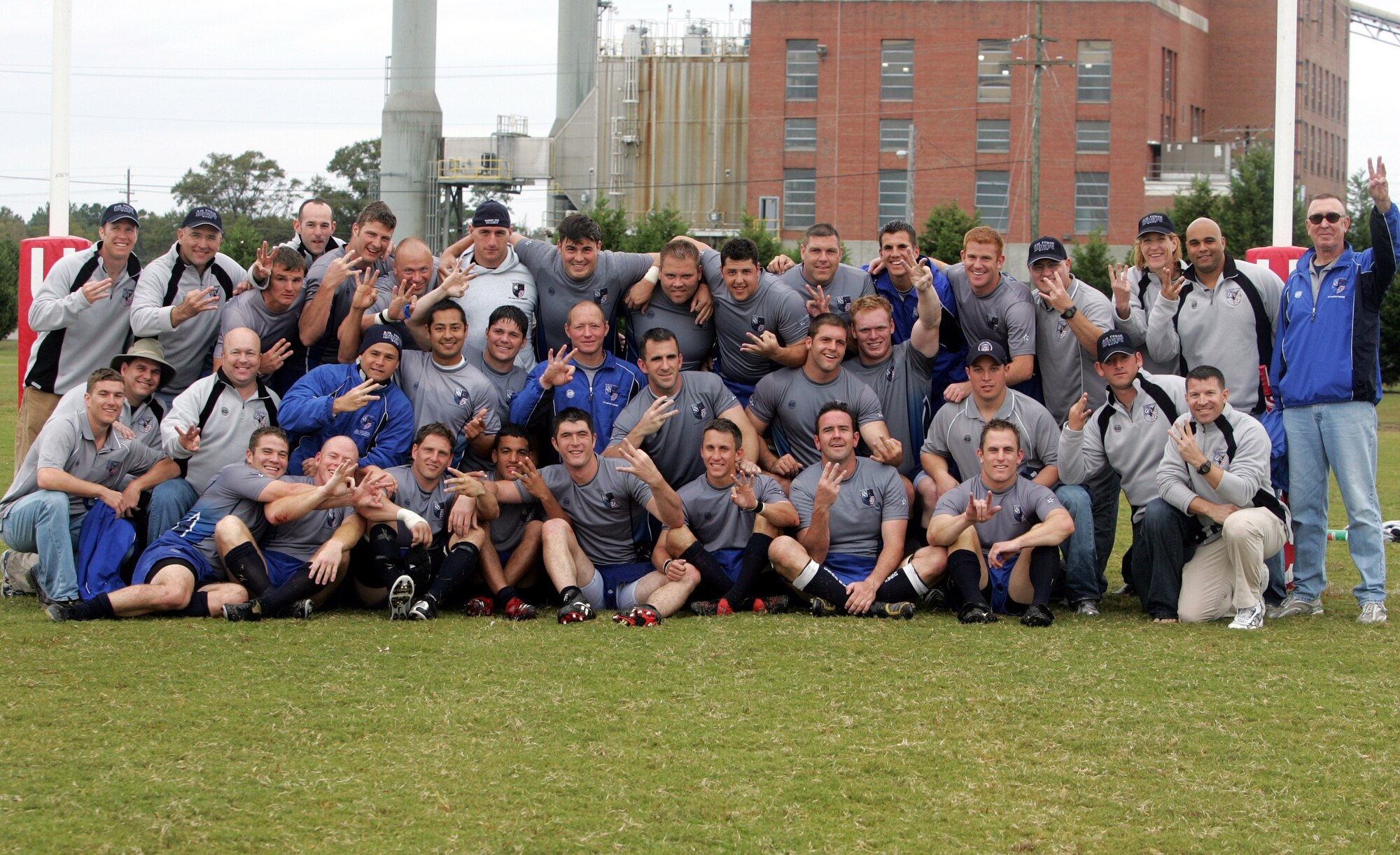 The Air Force rugby team celebrates after winning its third consecutive Armed Forces Rugby Championship tournament title.  The team was undefeated in this year's competition.  (U.S. Air Force photo/Major Scott Foley)