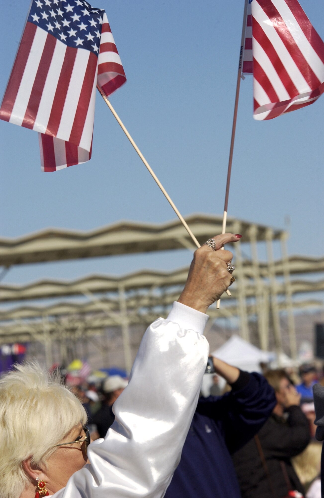 An air show spectator waves her flags during Aviation Nation 2006 Nov. 12 at Nellis Air Force Base, Nev. The show was held Nov. 11 and 12. (U.S. Air Force photo/Master Sgt. Kevin J. Gruenwald)
