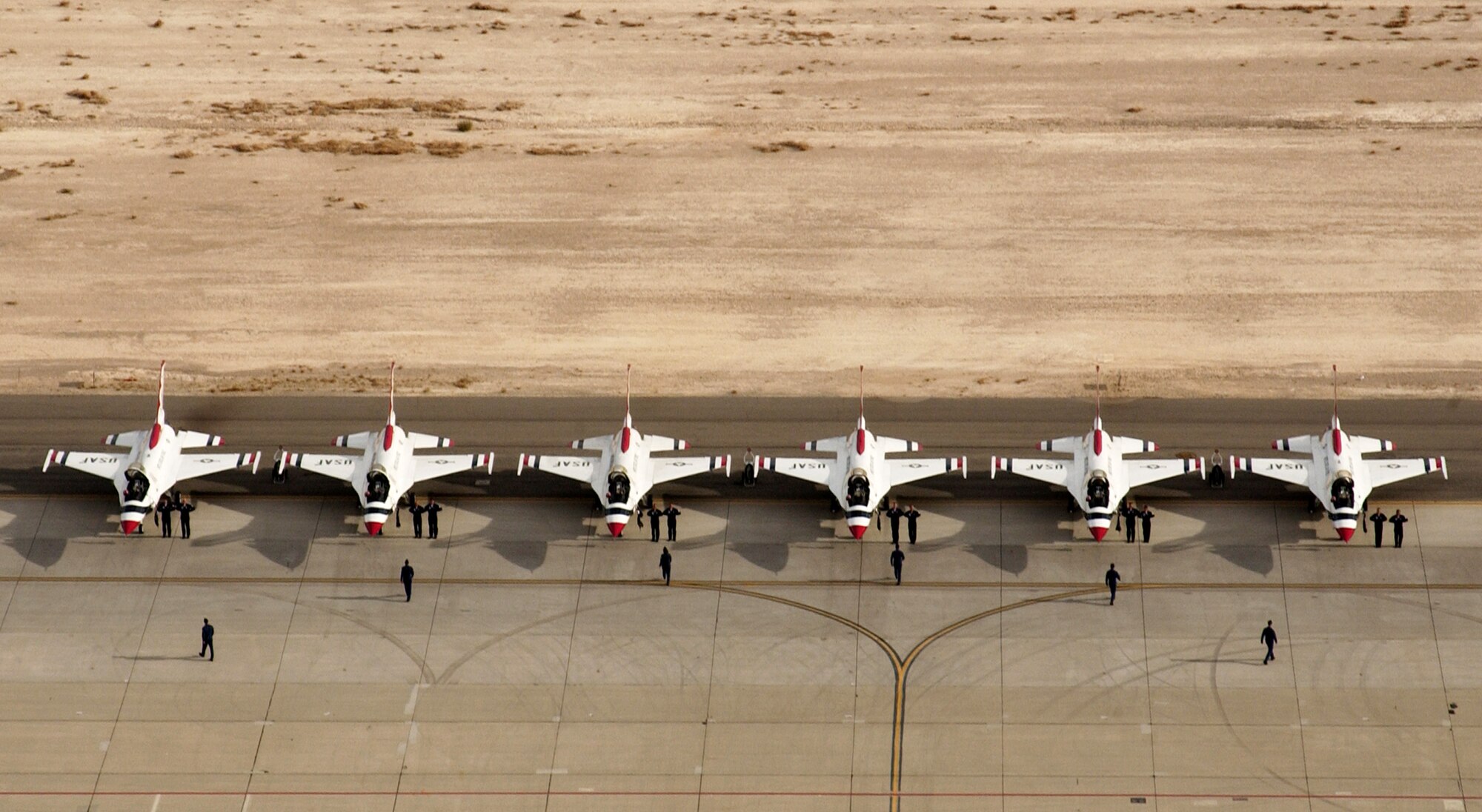 The U.S. Air Force Air Demonstration Squadron, the Thunderbirds, begin their ground show at the start of their demonstration during Aviation Nation 2006 Nov. 12 at Nellis Air Force Base, Nev. Aviation Nation has been called one of the most diverse, entertaining and well run air shows in America. (U.S. Air Force photo/Master Sgt. Kevin J. Gruenwald)
