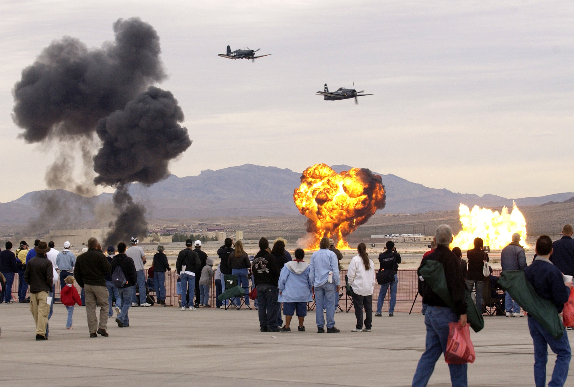 Air show spectators get a close look at a Korean War aerial re-enactment during Aviation Nation 2006 Nov. 11 at Nellis Air Force Base, Nev. The show was held Nov. 11 and 12. (U.S. Air Force photo/Master Sgt. Kevin J. Gruenwald)