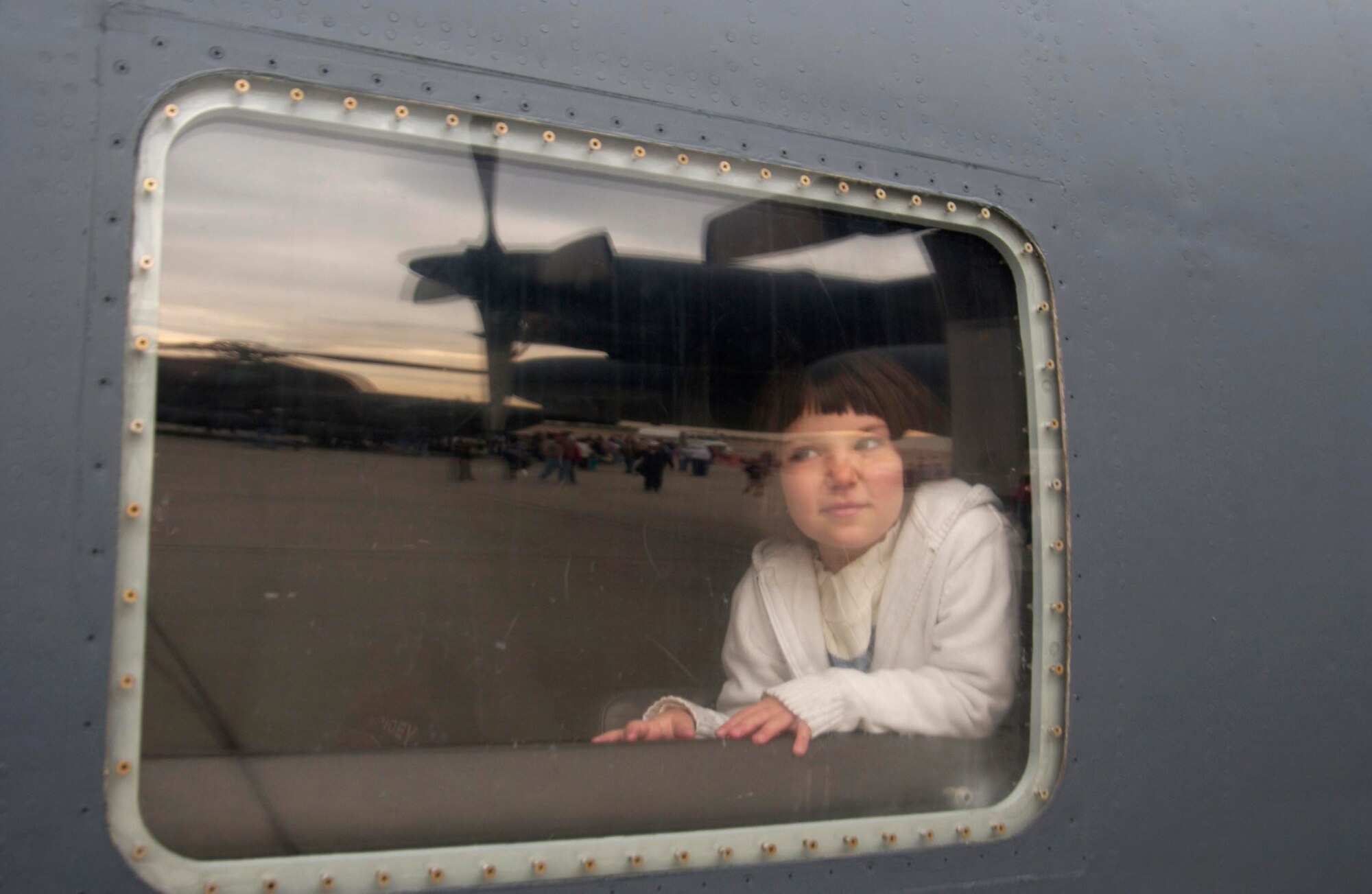 Cris Barba looks out the window of an MC-130E Combat Talon I during Aviation Nation 2006 Nov. 11 at Nellis Air Force Base, Nev. Aviation Nation has been called one of the most diverse, entertaining and well run air shows in America. The show was held Nov. 11 and 12. (U.S. Air Force photo/Master Sgt. Kevin J. Gruenwald)

