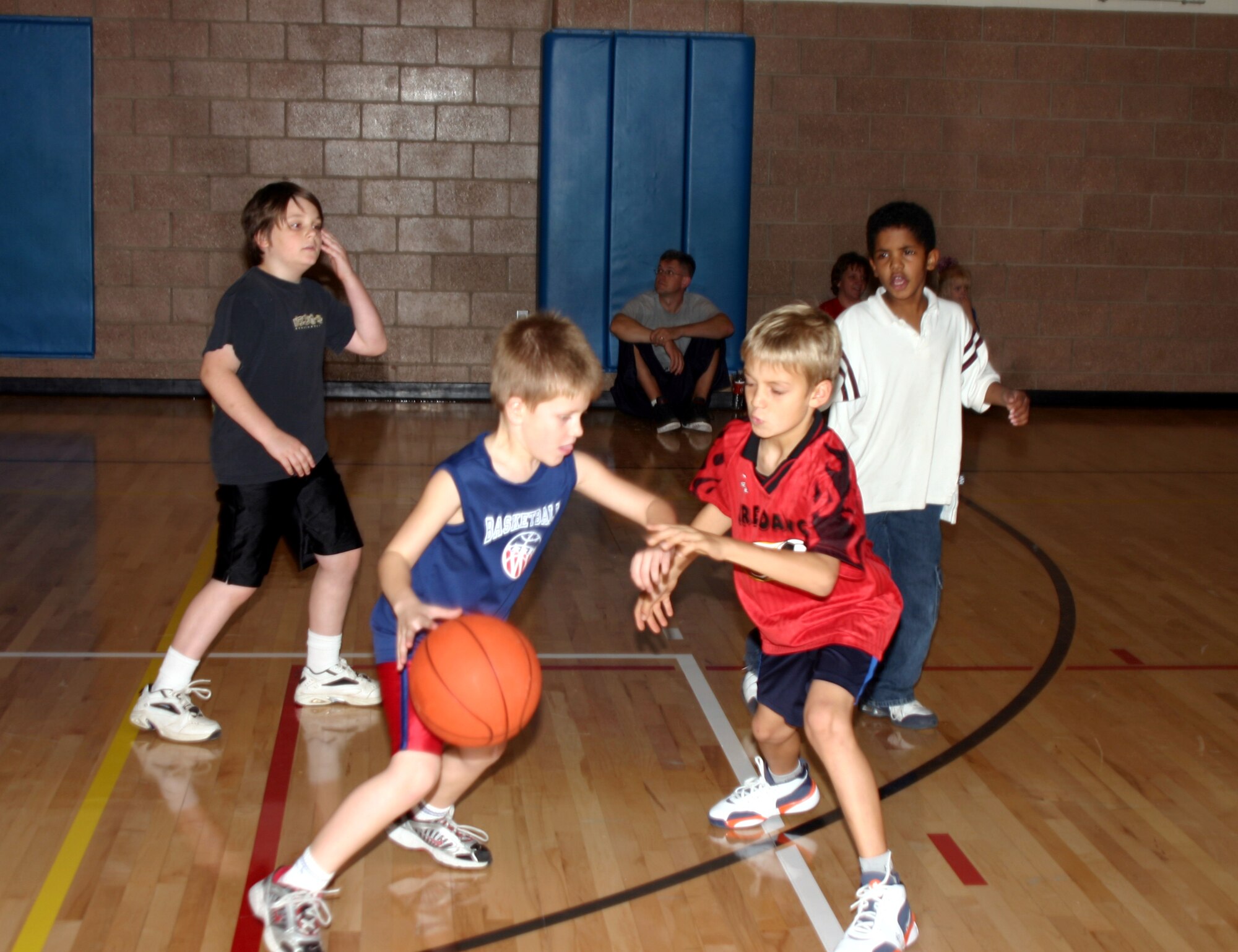 Participants in the Madrigal Youth Center’s youth basketball clinic practice dribbling and defense Nov. 9. The clinics were held in preperation for the youth basketball season. Registration for ages 3 to 12 is still going on, call the youth center at 676-5437 for more information.