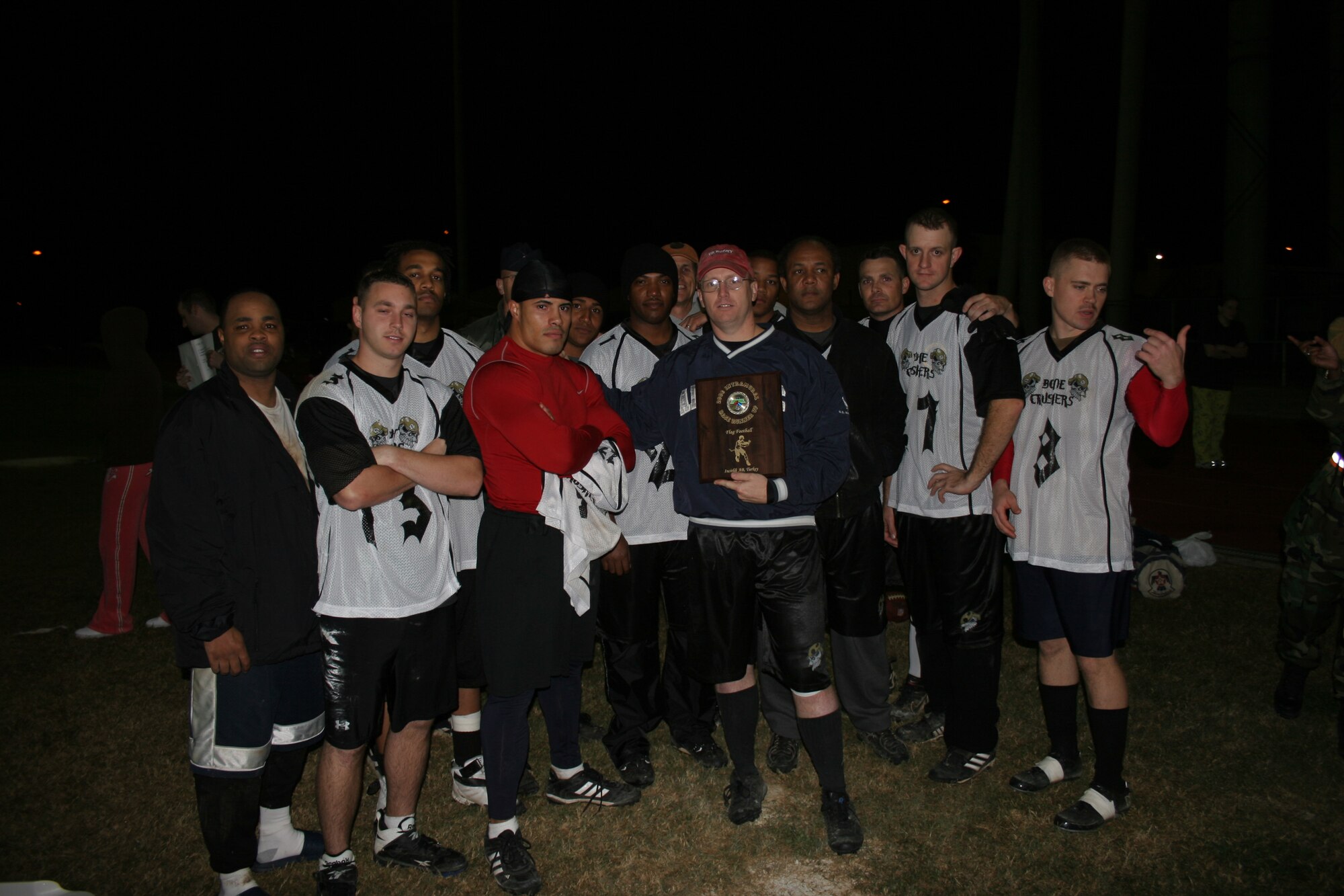 The members 39th Contracting Squadron/Civil Engineer Squadron intramural flag football team pose for a pic after losing to the 39th Logistic Readiness Squadron 18-12 in overtime. (U.S. Air Force photo by Staff Sgt. Oshawn Jefferson)