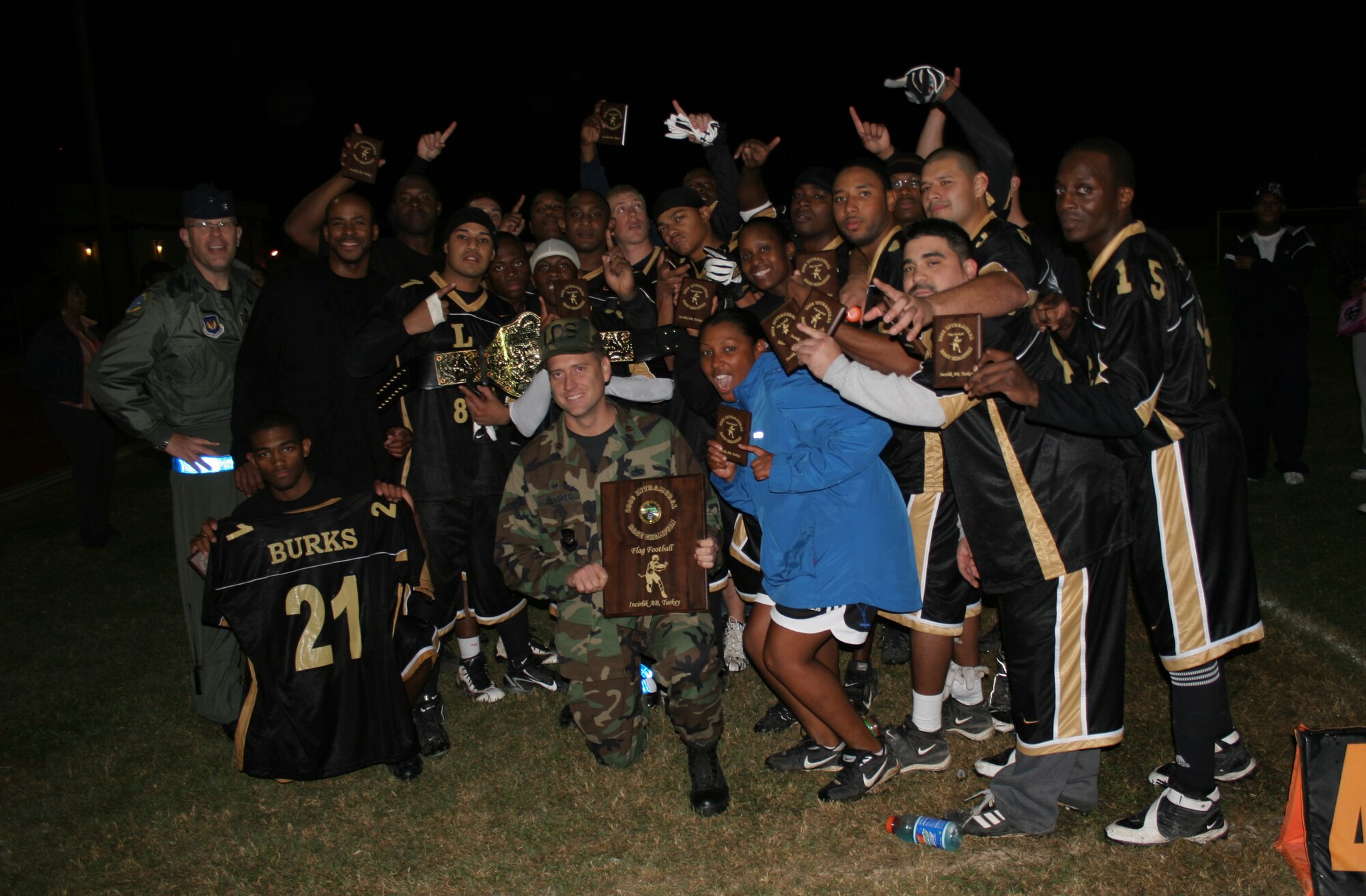 Members of the 2006 Incirlik Intramural Flag Football champion 39th Logistics Readiness Squadron hold up their championship trophies after defeating the 39th Contracting Squadron/Civil Engineer Squadron team 18-12 in overtime Nov. 14. (U.S. AIr Force photo by Staff Sgt. Oshawn Jefferson) 