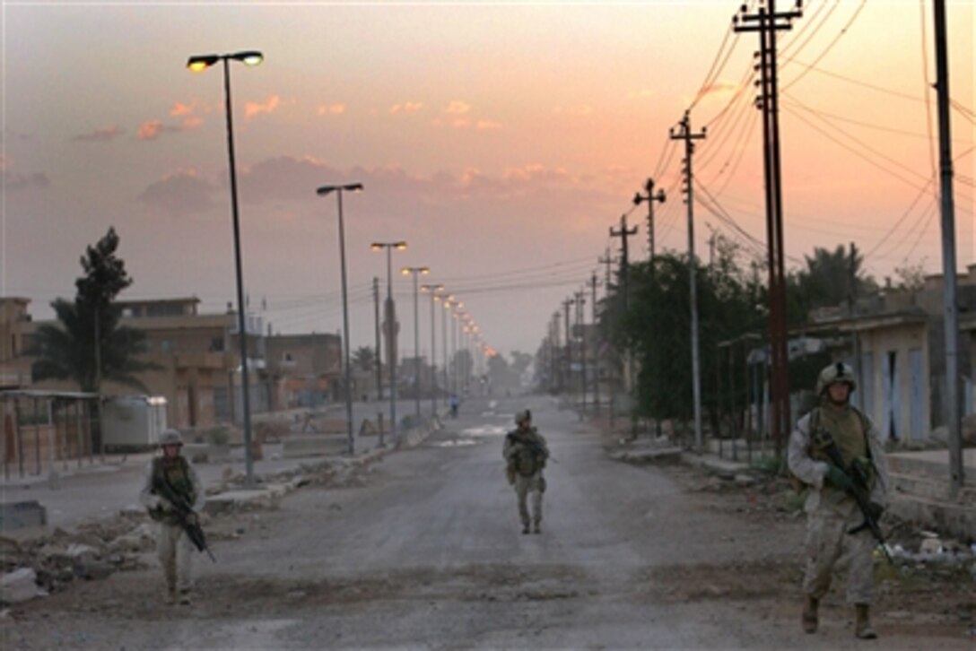 U.S. Marines conduct a twilight patrol through the deserted streets of Husaybah, Iraq, on Oct. 31, 2006. The Marines are attached to 3rd Battalion, 4th Marine Regiment, Regimental Combat Team 7, I Marine Expeditionary Force (Forward).  