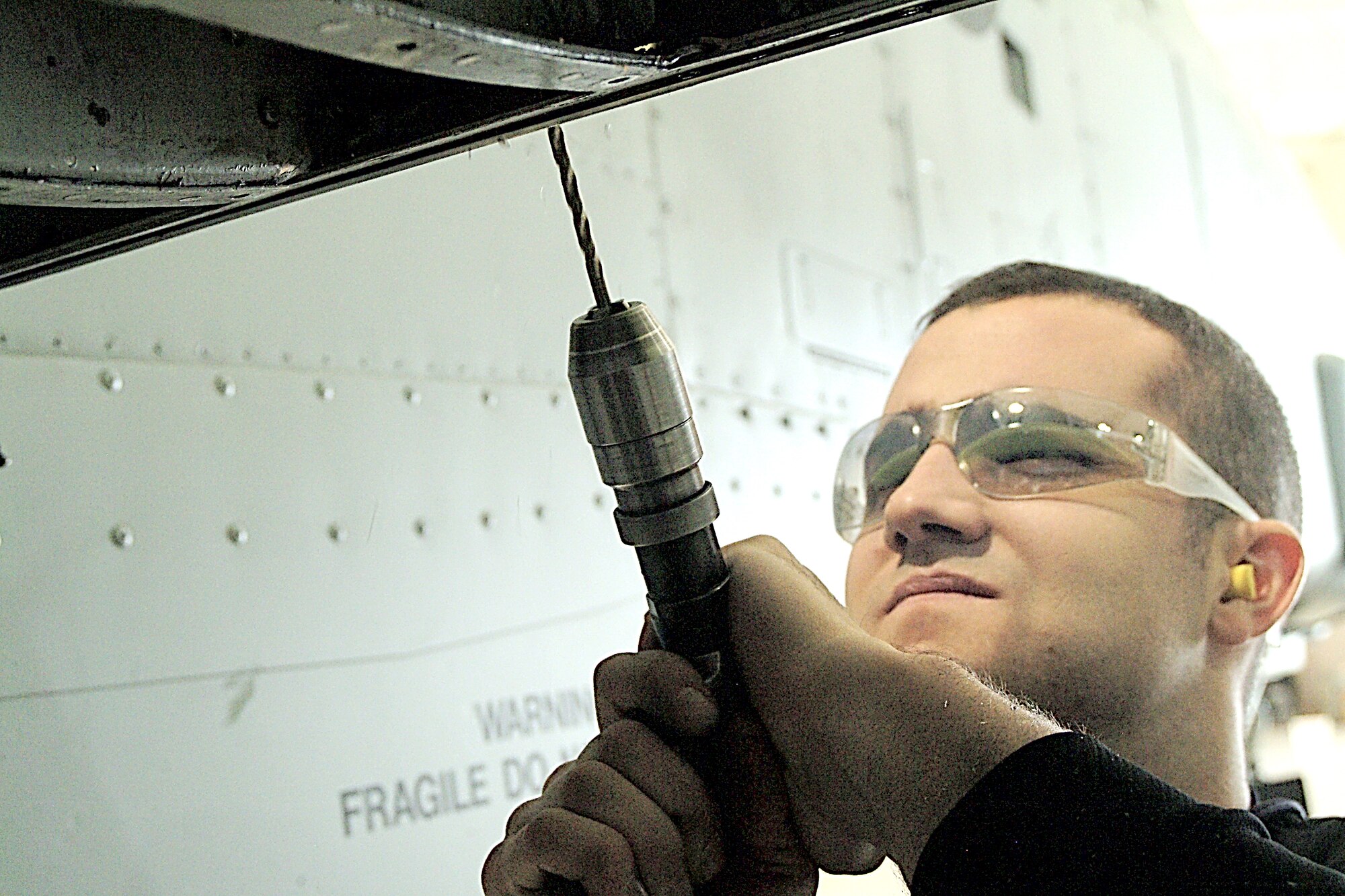 WHITEMAN AFB, Mo. -- A second generation 442nd Fighter Wing member here, Senior Airman Cameron McWilliams, now with 442nd Maintenance Squadron Structures shop, has previously worked in the 442nd MXS Metals Technology shop. (US Air Force photo/Master Sgt. Bill Huntington)
