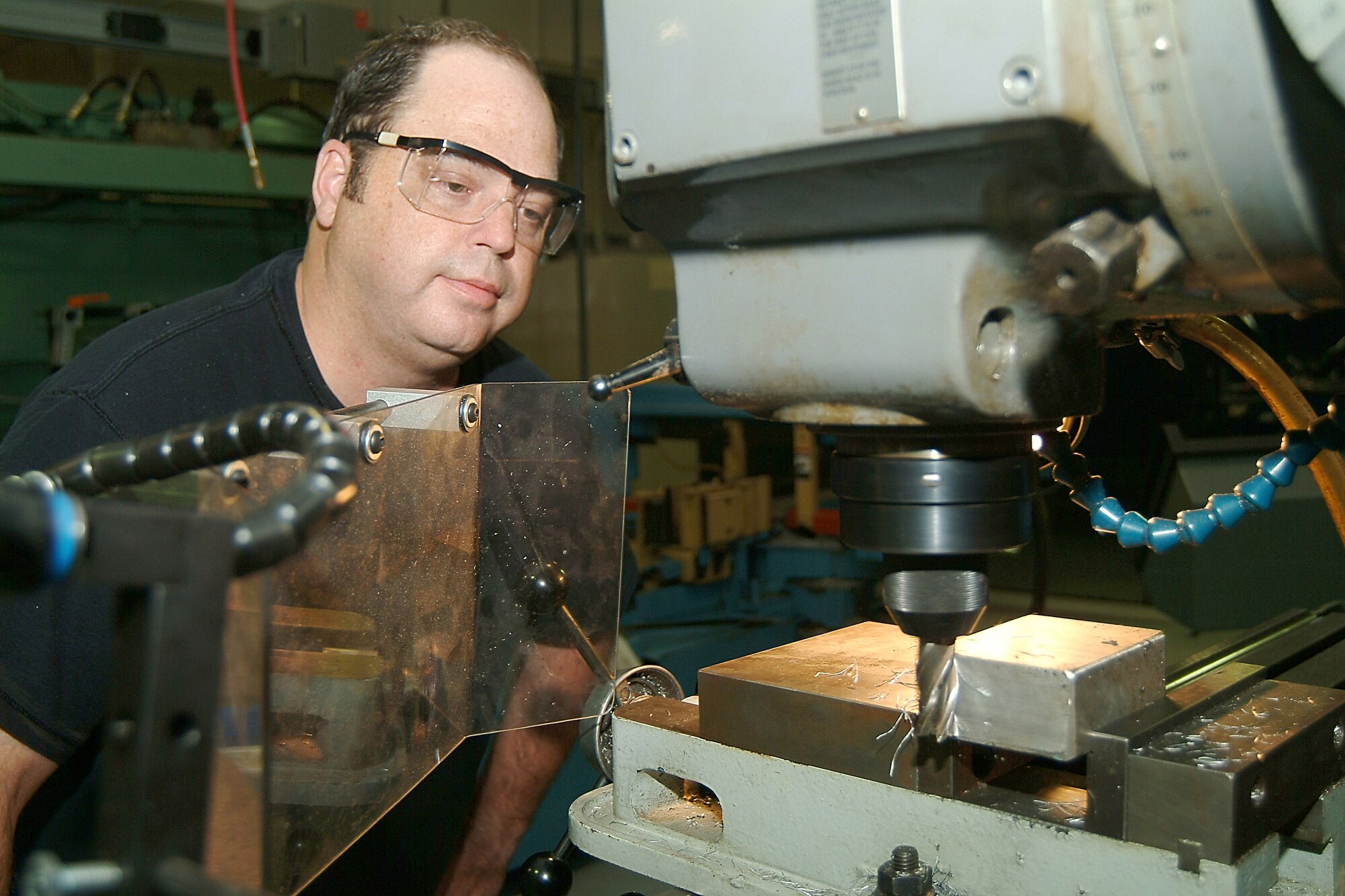 WHITEMAN AFB, Mo. -- Tech. Sgt. Wesley Reeves, a metals technology reservist with the 442nd Maintenance Squadron, part of the 442nd Fighter Wing here, uses a milling machine to shape a piece of metal. (US Air Force photo/Master Sgt. Bill Huntington)