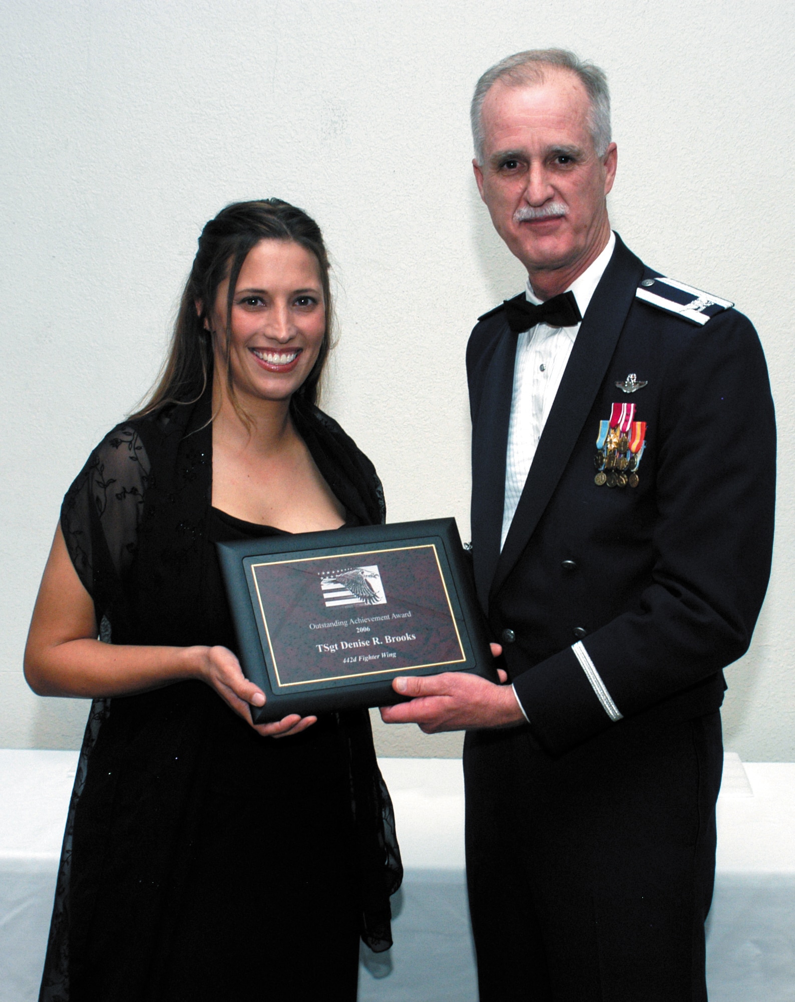 Col. Robert "Steve" Arthur, 442nd Fighter Wing commander, awards Tech. Sgt. Denise Brooks the 2006 Outstanding Achievement Award at Hogfest Nov. 4 at the Missouri State Fairgrounds.    The 442nd Maintenance Group holds the annual event to honor the best of its enlisted maintainers from throughout the year.  The evening includes a dinner, awards presentation and dancing.    This year's other winners were:    Munitions and armament junior enlisted member, Senior Airman Michael Oehlert.    Munitions and armament senior enlisted member, Senior Master Sgt. Russell Rackers.    Maintenance squadron junior enlisted member, Staff Sgt. Dustin Wright.    Maintenance squadron senior enlisted member, Senior Master Sgt. Gary Thornberry.    Maintenance operations flight junior enlisted member, Airman 1st Class Sheila Cook.    Maintenance operations flight senior enlisted member, Master Sgt. Charles Cousins.    Aircraft maintenance squadron junior enlisted member, Senior Airman Andrea Bax.    Aircraft maintenance squadron senior enlisted member, Master Sgt. Daniel Thessen.Maintenance group junior enlisted member, Staff Sgt. Dustin Wright.    Maintenance group senior enlisted member, 	Senior Master Sgt. Gary Thornberry.    Crew chief of the year, Tech. Sgt. Kellie 	Askew.    Assistant crew chief of the year, Master Sgt. Jim McGilton.    Load crew of the year, Master Sgt. Kenneth McKee, Senior Airman Phillip Travalent and	Staff Sgt. Lincoln McCoy.    Community service award, Master Sgt. Jerry Nicas.