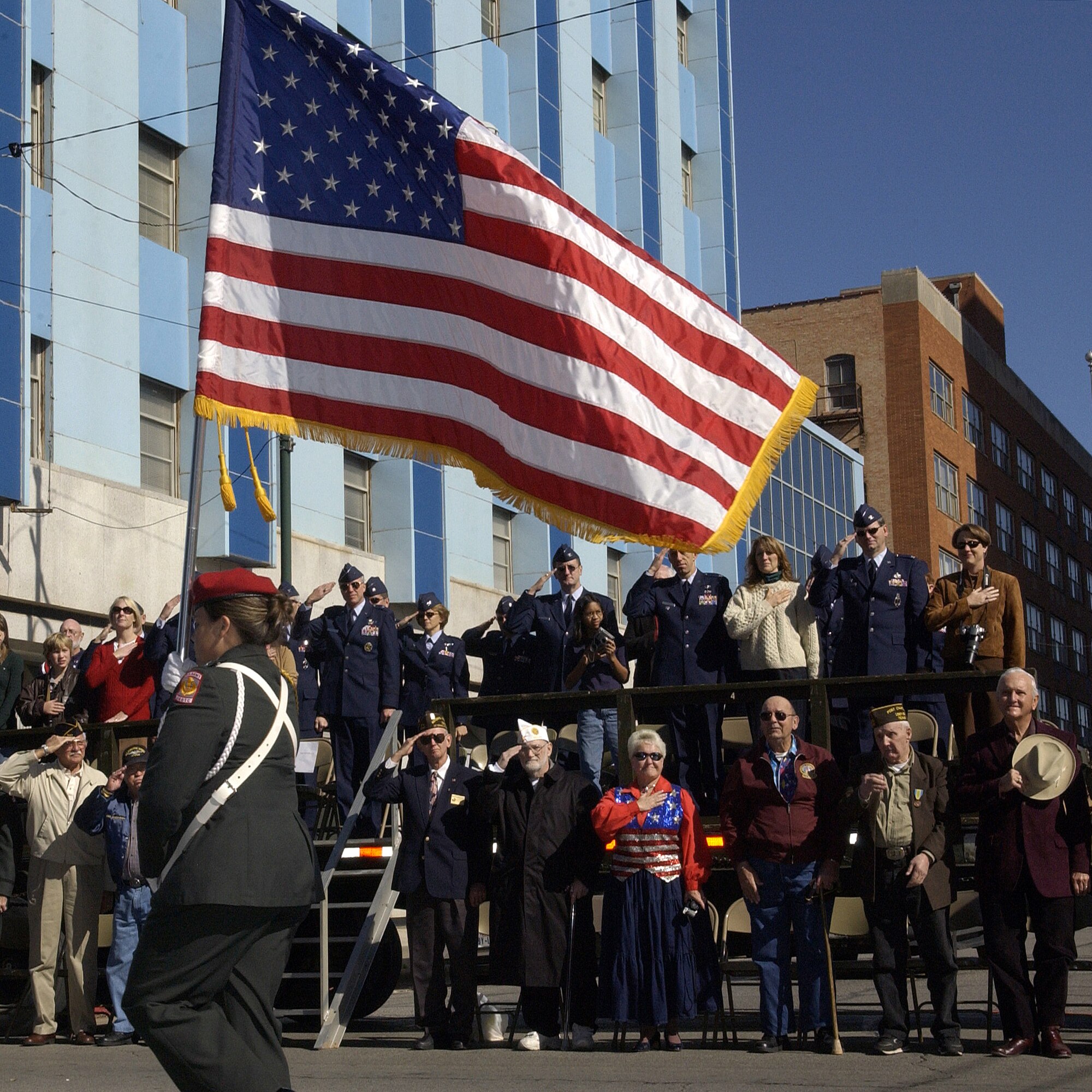 Officers from Sheppard salute Old Glory as it passes the reviewing stand Saturday during the North Texas Veteran’s Council’s annual Veterans Day parade. (U.S. Air Force photo/Mike Litteken).