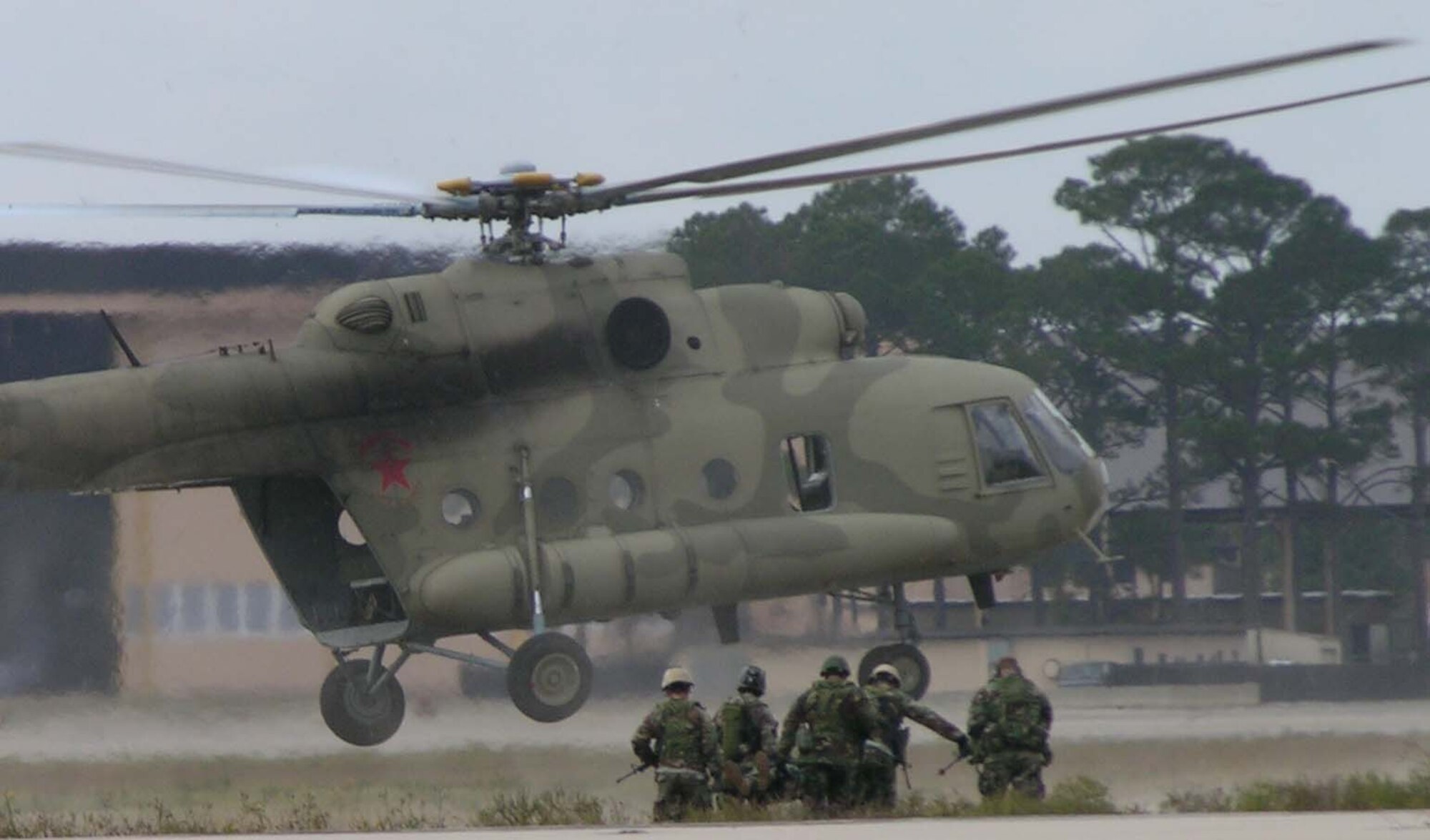 Members of the 720th Special Tactics Group simulate a rescue mission during an air power demonstration at a ceremony celebrating the 60th birthday of the Air Force and the arrival of the CV-22 Osprey.           