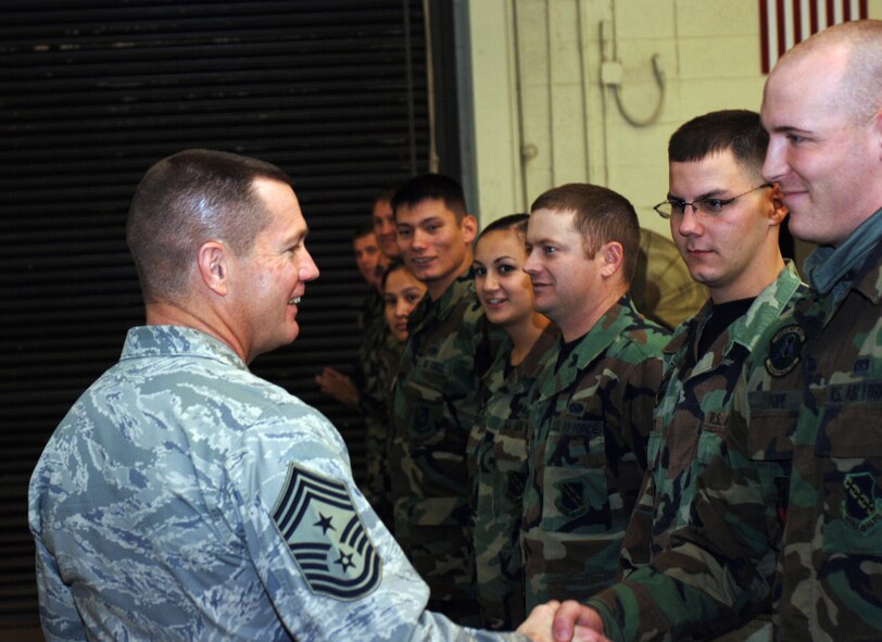 Command Chief Master Sgt. David Popp, Air Combat Command command chief, is greeted by Airman 1st Class Larry Pope and all the 7th Equipment Maintenance Squadron fabrication shop Airmen during his visit to Dyess Wednesday. Chief Popp toured the facility to see their accomplishments and raise morale.
