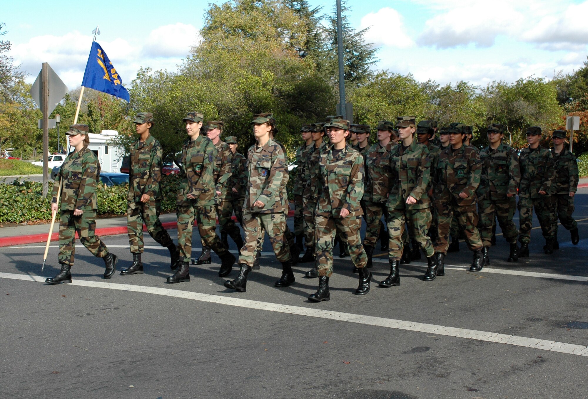An all-female flight formation keeps in step as its marches down Kentucky Street during the City of Fairfield’s sixth annual Veterans Day parade. All four of Travis' formations were commanded by women. The city dedicated this year’s Veterans Day parade and other activities to female veterans. (U.S. Air Force photo by Staff Sgt. Candy Knight/ 60th Air Mobility Wing Public Affairs)