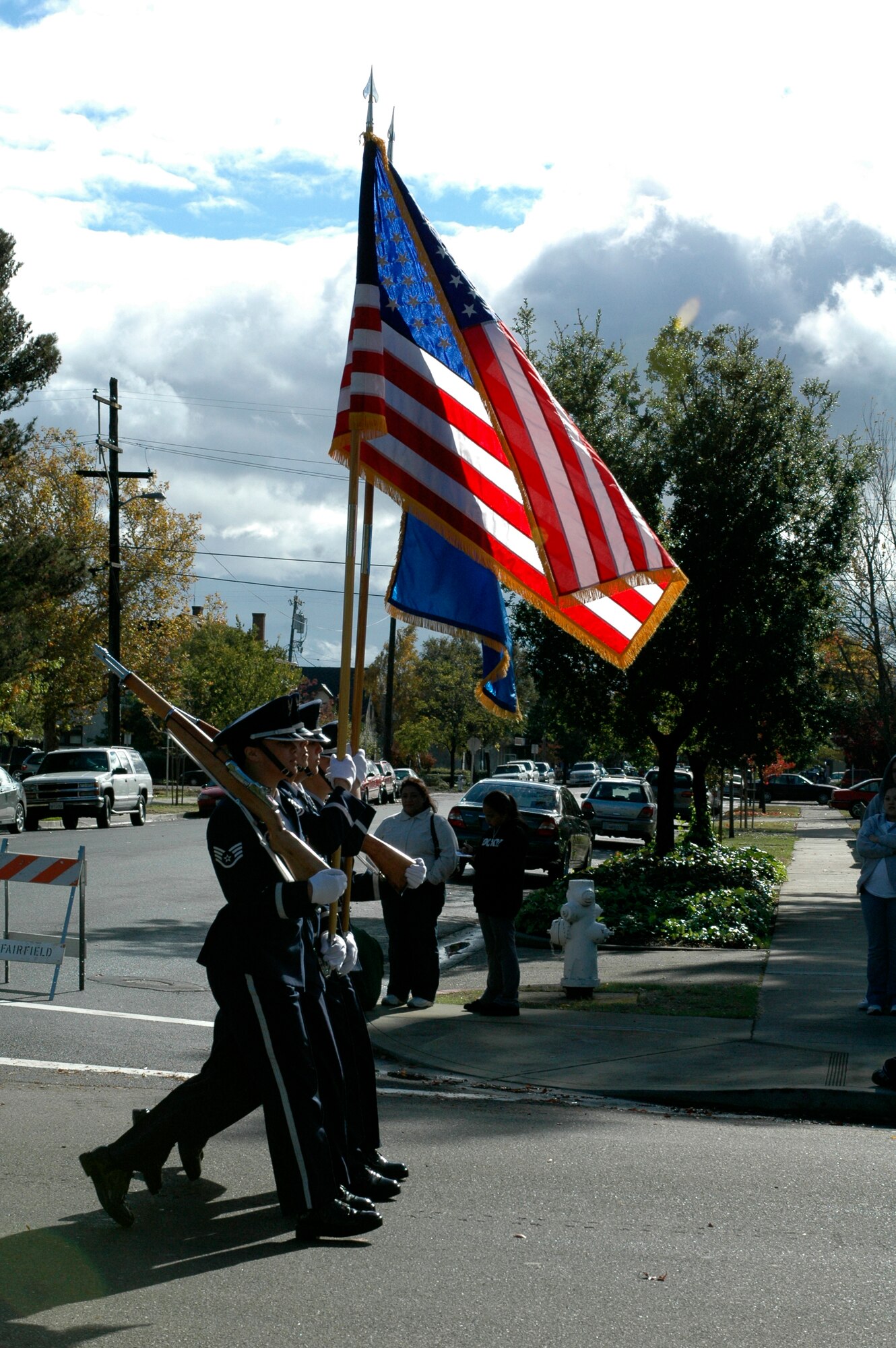 Members of the Travis Honor Guard marched down Kentucky Street during the City of Fairfield’s Veterans Day Parade, Nov. 11. Members from the 60th Air Mobility Wing, 349th AMW and the 615th Contingency Response Wing participated in this year’s parade, marching through historic downtown Fairfield along with several marching bands, floats and vehicles from around the area. (U.S. Air Force photo by Staff Sgt. Candy Knight/60th Air Mobility Wing Public Affairs)