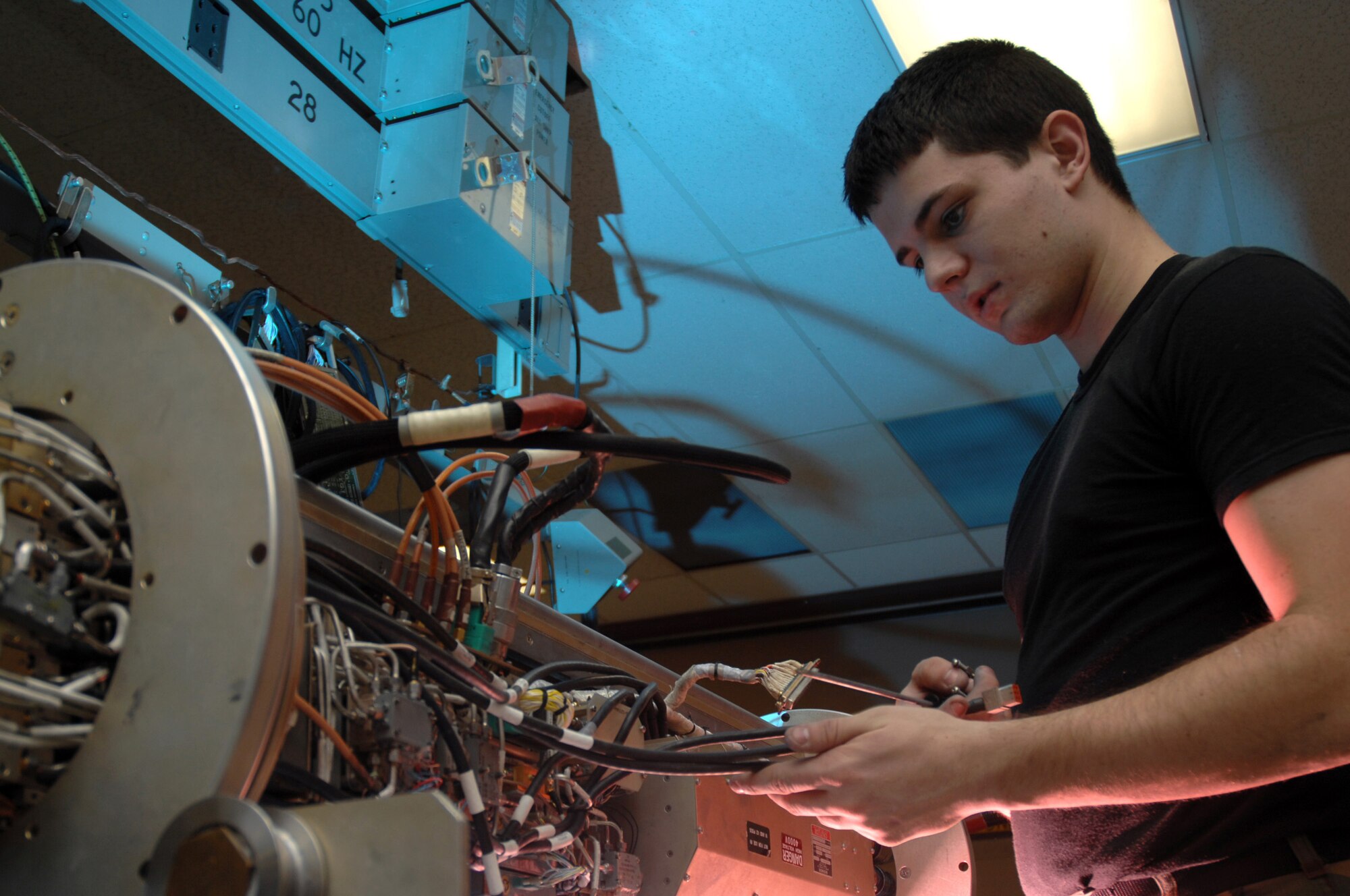 Airman 1st Class Robert Wulff troubleshoots a high voltage power supply on an ANALQ1 84 Electronic Counter Measures pod Nov. 15 at Eielson Air Force Base, Alaska. Airman Wulff is an electronic warfare systems apprentice with the 354th Maintenance Squadron at Eielson AFB. (U.S. Air Force photo/Staff Sgt. Joshua Strang)