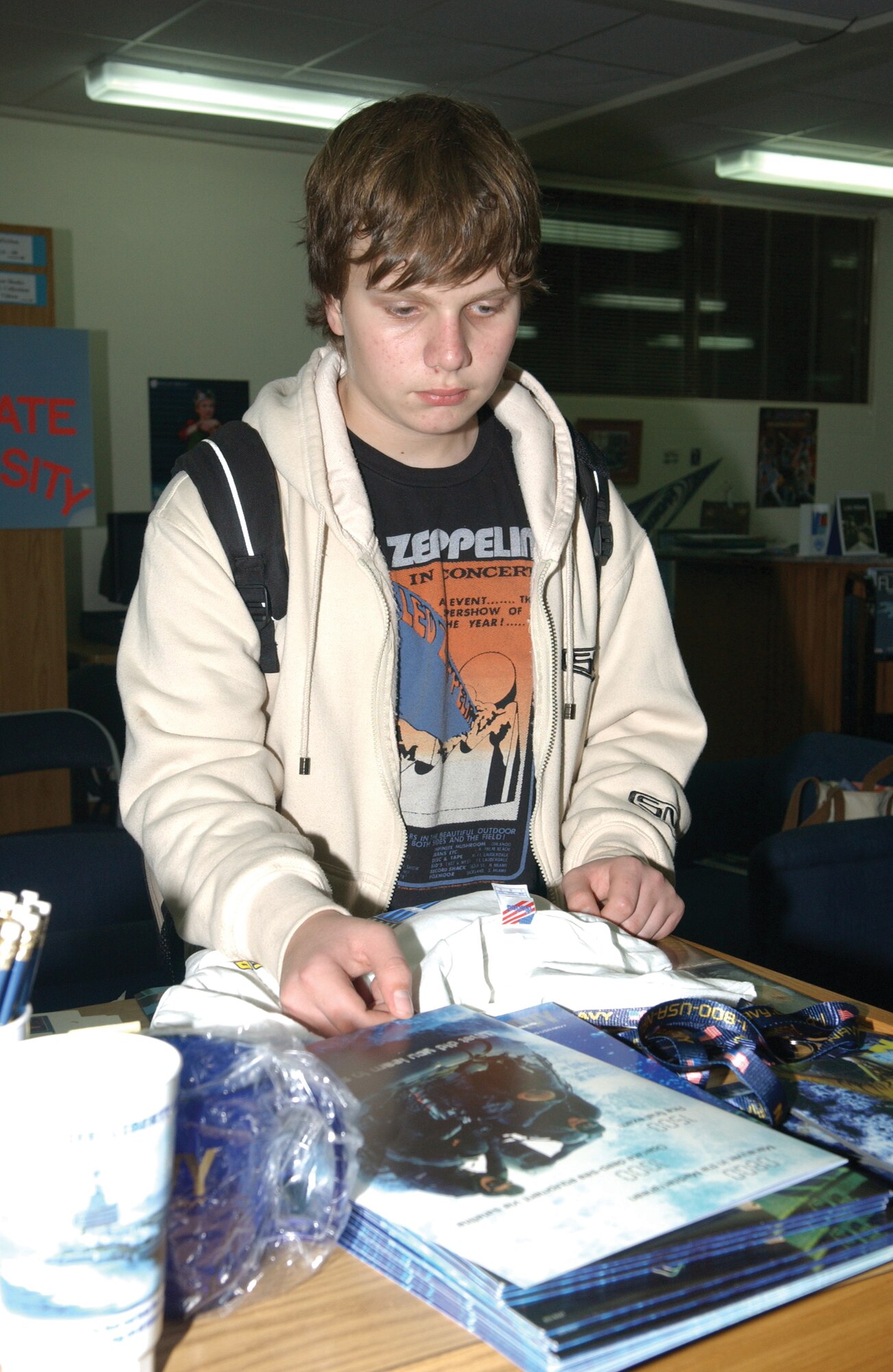 Douglas Eaton, a student at Incirlik High School, looks at the Navy Reserve booth during College Night at Incirlik American School on Nov. 15.  College Night was held in the media center at the high school and it was a way for high school students to learn about different colleges and the education opportunities available to them. (U.S. Air Force photo by Airman First Class Tiffany A. Colburn).

                           