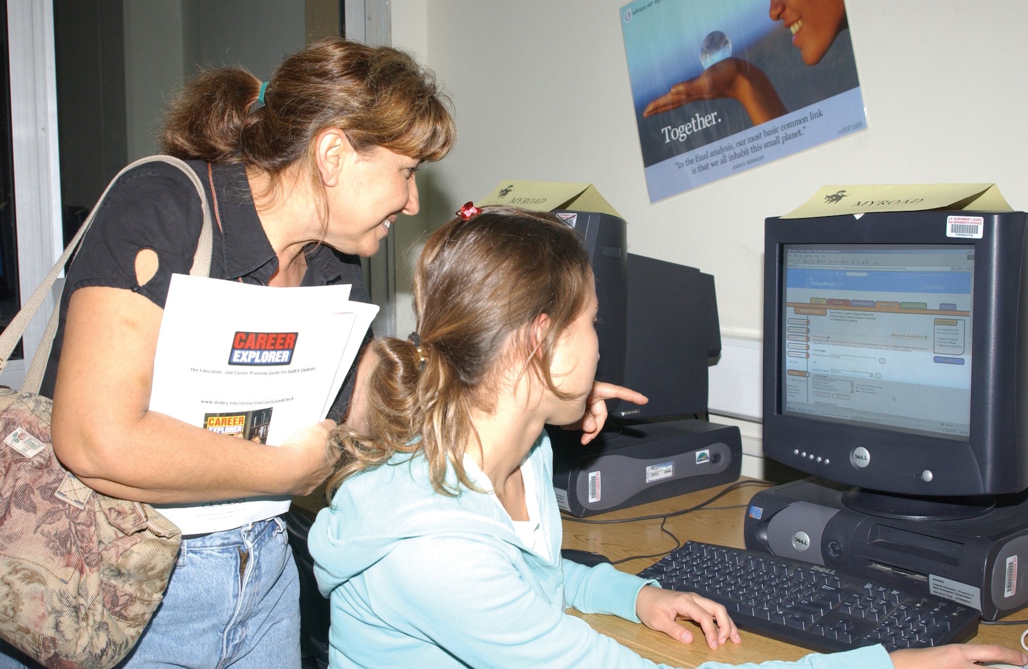 Orchid Siedow, left, and her daughter, Beyham, a junior at Incirlik High School, look online for colleges during College Night at Incirlik American School on Nov. 15. College Night was held in the media menter at the shchool and it was a way for high school students and their parents to learn about different colleges and the education opportunities available to them. (U.S. Air Force photo by Airman 1st Class Tiffany A. Colburn)                               