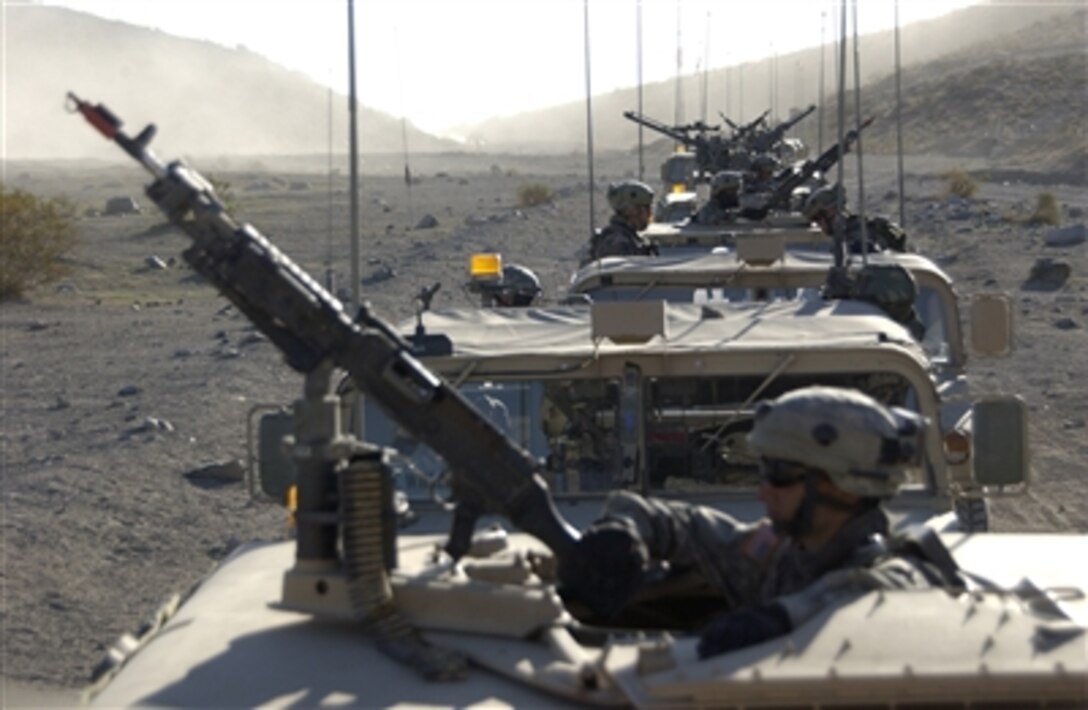 U.S. Army soldiers with 1st Squadron, 4th Cavalry Regiment, 4th Infantry Brigade Combat Team, 1st Infantry Division (Mechanized) wait for the order to move out during a convoy exercise at the National Training Center on Fort Irwin, Calif., Nov. 7, 2006. 