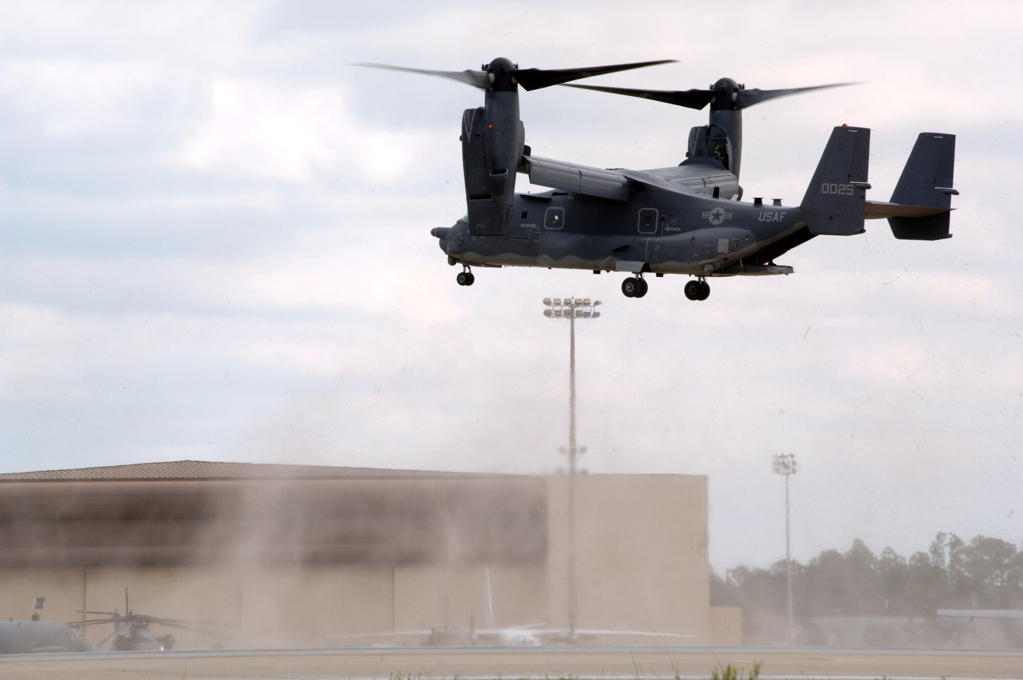 The CV-22 Osprey hovers over the Hurlburt Field, Fla., flightline during its unveiling ceremony Nov 16.  The arrival of the CV-22 to Air Force Special Operations Command is part of Hurlburt Field's Heritage to Horizon commemoration, reflecting on the heritage of air commandos, reaffirming the commitment to the war on terrorism and resolving to continually expand capabilities. The commemoration also includes marking the re-designation of the 16th Special Operations Wing to the 1st SOW and the Air Force's 60th birthday.  (U.S. Air Force photo/Senior Airman Ali E. Flisek)