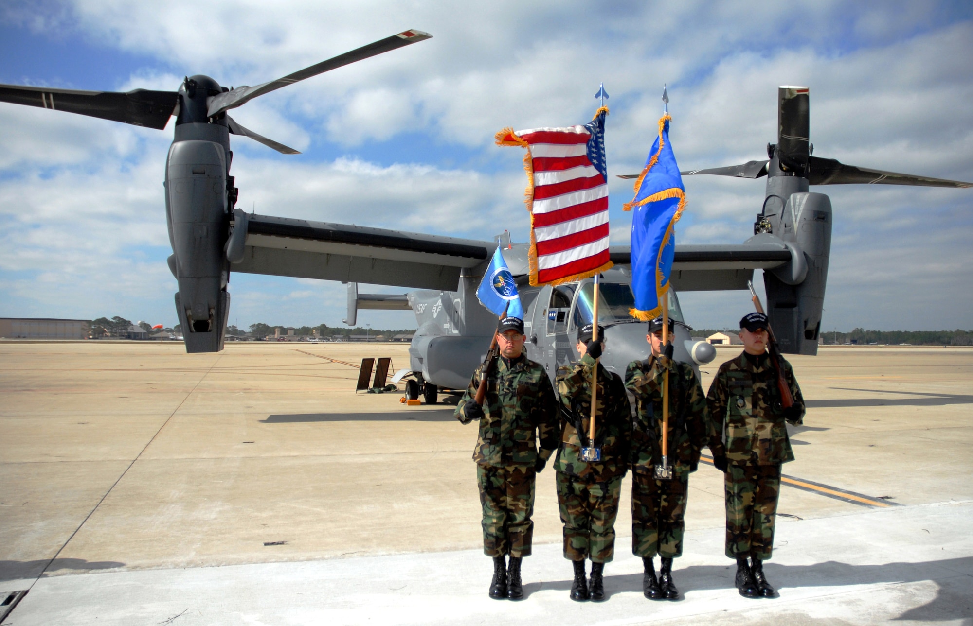Airman 1st Class Joshua Penery (left to right), Senior Airman Cody Husemann, Airman 1st Class Jeffrey Miller and Airman 1st Class Steven Bickell, members of the 16th Special Operations Wing Honor Guard, perform in front of a CV-22 Osprey during the Air Force 60th Anniversary commemoration held at Hurlburt Field, Fla., on Nov.16.  The commemoration was marked by the arrival of the CV-22 Osprey to Hurlburt Field and the redesignation of Air Force Special Operations Command's 16th Special Operations Wing as the 1st SOW.  (U.S. Air Force photo/Chief Master Sgt. Gary Emery)