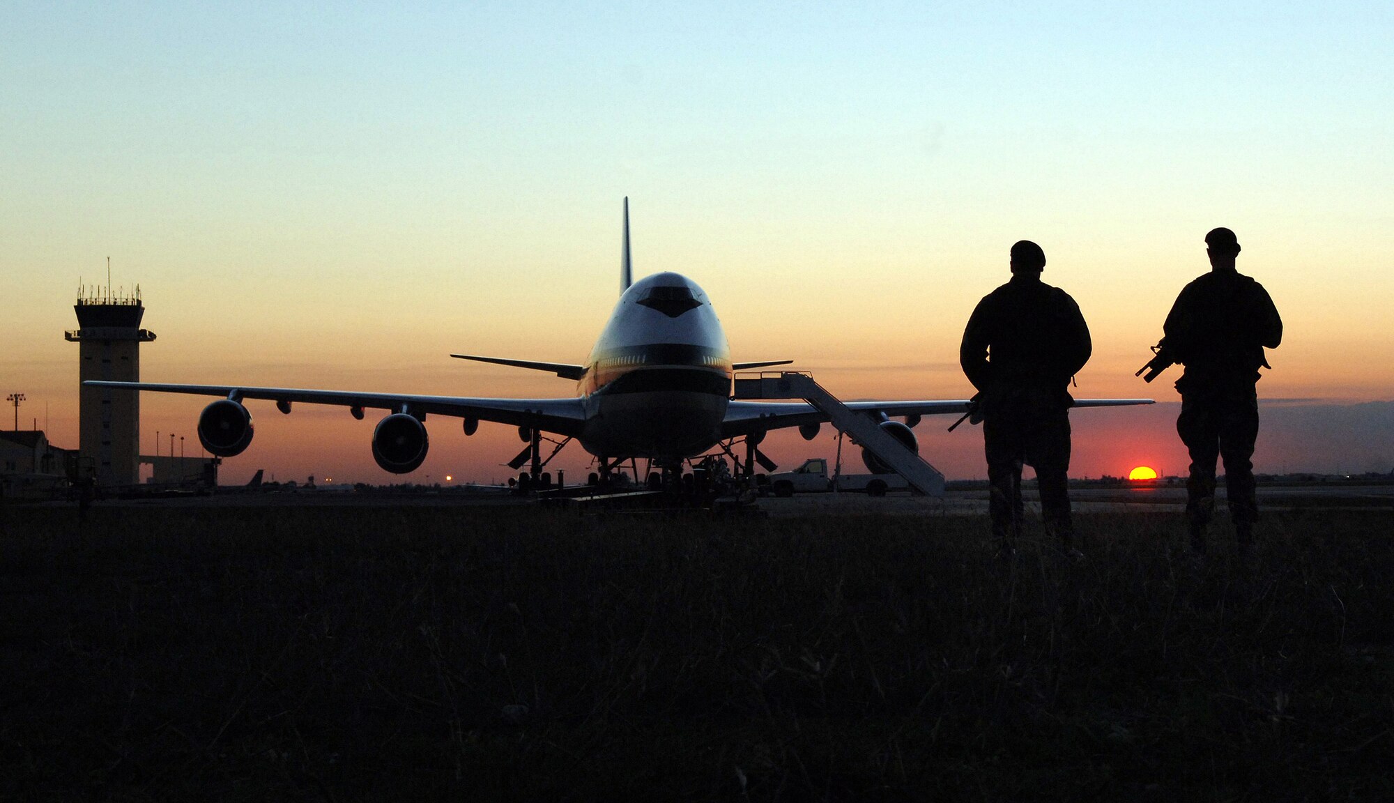 Two security forces airmen patrol the runway at Incirlik Air Base, Turkey, Nov. 15. More than half of all air cargo delivered to support Operation Iraqi Freedom is processed through here. Due to the close proximity of Incirlik to Iraq and the ability to land at more and smaller runways, flights from here have kept at least 3,300 convoy trucks and 9,000 servicemembers from harm's way. (U.S. Air Force photo/Tech. Sgt. Larry A. Simmons)
