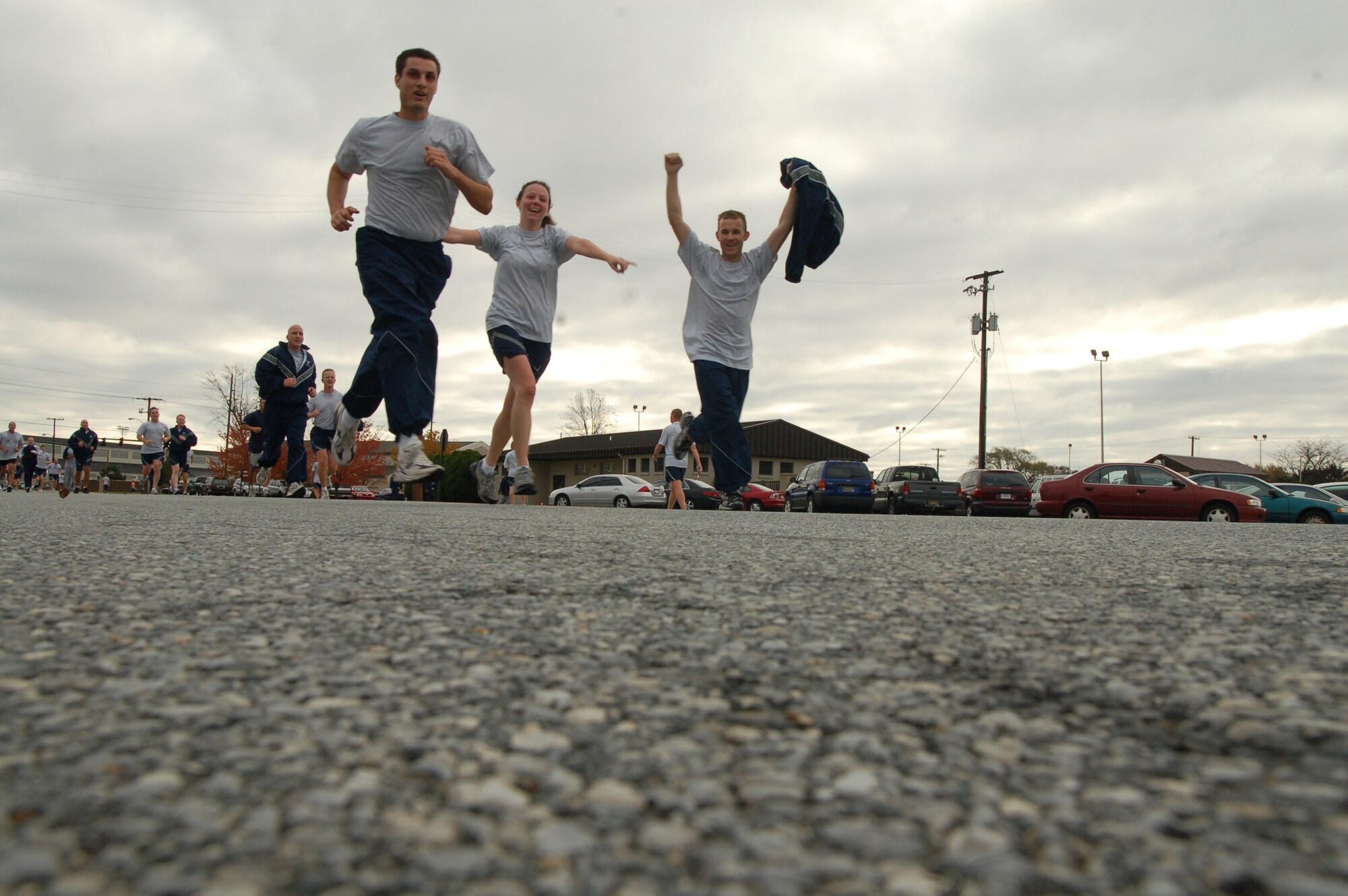 Members of Dover Air Force Base celebrate Wingman Day here with a Warrior Fun Run early Nov. 9. The Wingman Program charges Air Force personnel to vigilantly monitor the welfare and development of their fellow Airmen, especially during high-stress periods and increased mission operations. It also encourages professionals to mentor and watch out for their fellow Airmen throughout their career. Units base-wide met within their organizations to discuss how to work through stressful times, where to get help from different agencies on base and how to cultivate a continual teamwork attitude throughout the base. (U.S. Air Force photo/1st Lt. Chris Sukach)