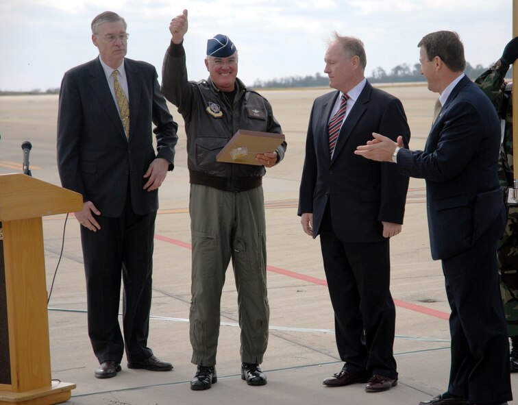 Lt. Gen. Michael W. Wooley, commander of Air Force Special Operations Command, gives the crowd a thumbs-up after receiving the ceremonial ?key? to the first CV-22 Osprey at Hurlburt Field, Fla., on Nov 16.  Gen. Wooley piloted the CV-22 to Air Force Special Operations Command?s Air Force 60th Anniversary commemoration.  Photo by Chief Master Sgt. Gary Emery.