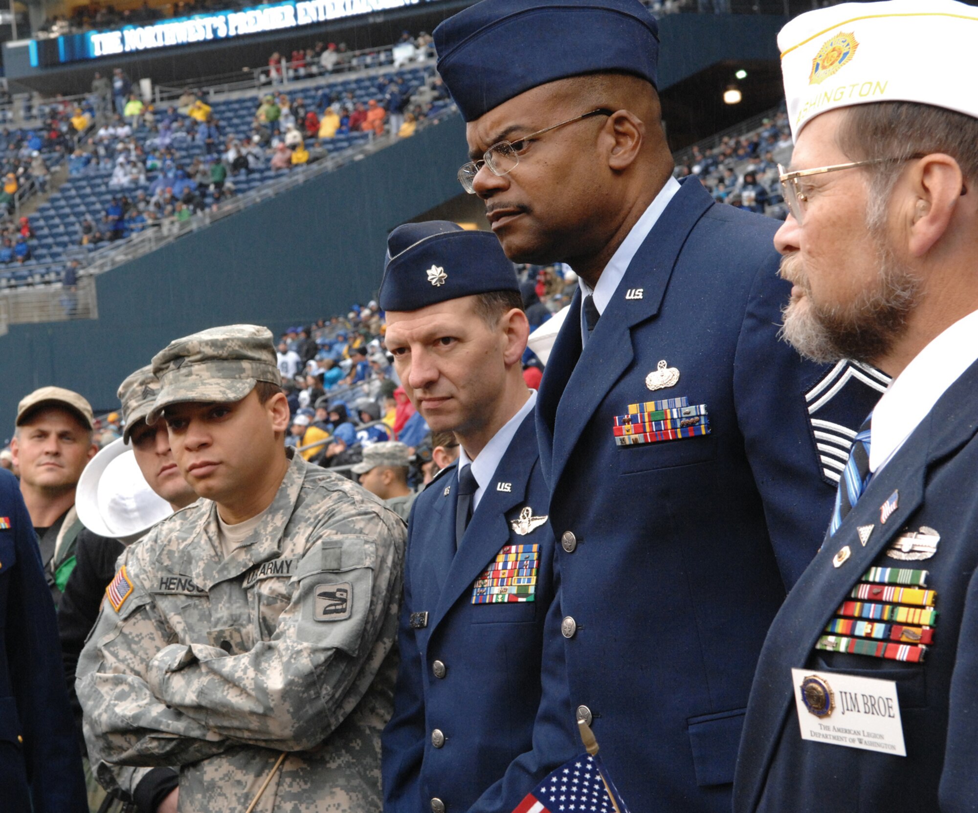 MCCHORD AIR FORCE BASE, Wash., - Lt. Col. James Kline, second from left, stands to the right of Senior Master Sgt. Stephen Harris as they listen to instructions for the Seattle Seahawks' on field salute to veterans at the Seahawks versus St. Louis Rams game Nov. 12.  Representing the Air Force Reserve and 446th Airlift Wing, Colonel Kline is with the 728th Airlift Squadron and Sergeant Harris is with the 446th Services Flight.  The Seattle Seahawks won 24-22. (U.S. Air Force photo by Abe Guzman)