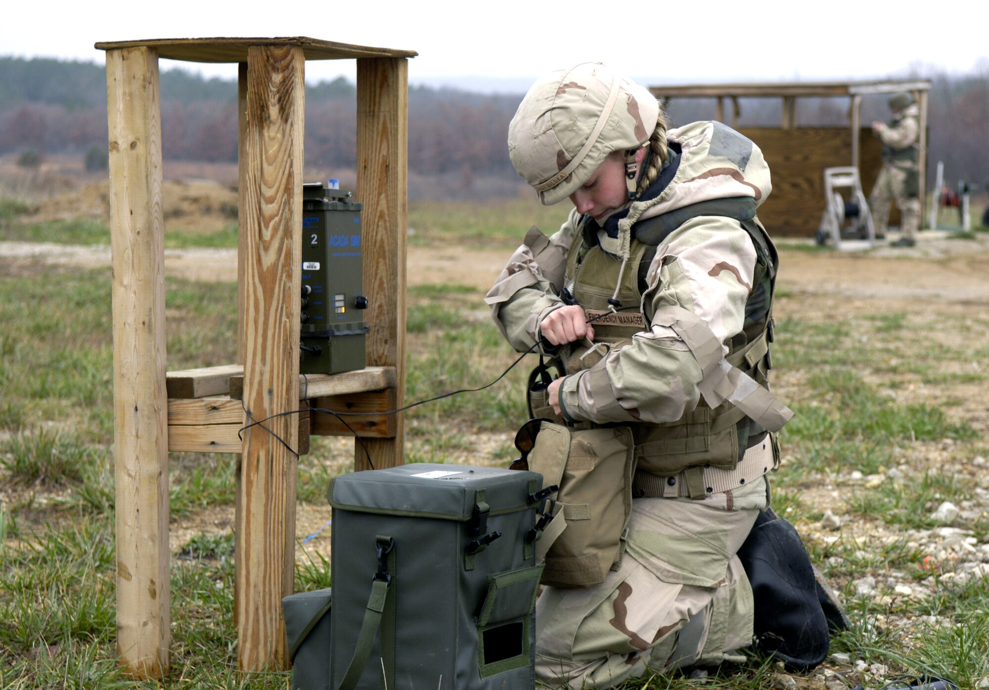 Staff Sgt. Renaissance Gildea sets up threat-detection network Nov. 16 during a readiness exercise at Fort Leonard Wood, Mo. The exercise is designed to give readiness Airmen training scenarios developed from lessons learned during operations Iraqi Freedom and Enduring Freedom. The two-day exercise is the part of a two-week training class here. (U.S. Air Force photo/Senior Airman Brian Ferguson)