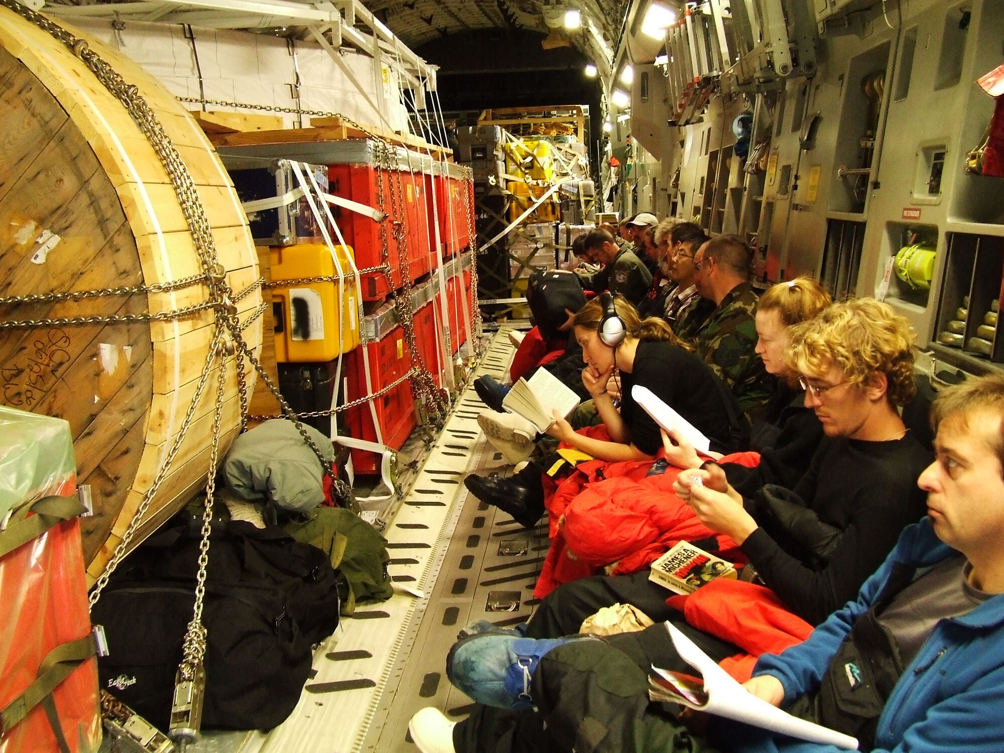 MCMURDO STATION, Antarctica - National Science Foundation personnel pass the time during a flight on a McChord C-17 Globemaster III from Christchurch, New Zealand, to Antarctica Nov. 14, 2006. U.S. Air Force Photo/ By 1st Lt Erika Yepsen