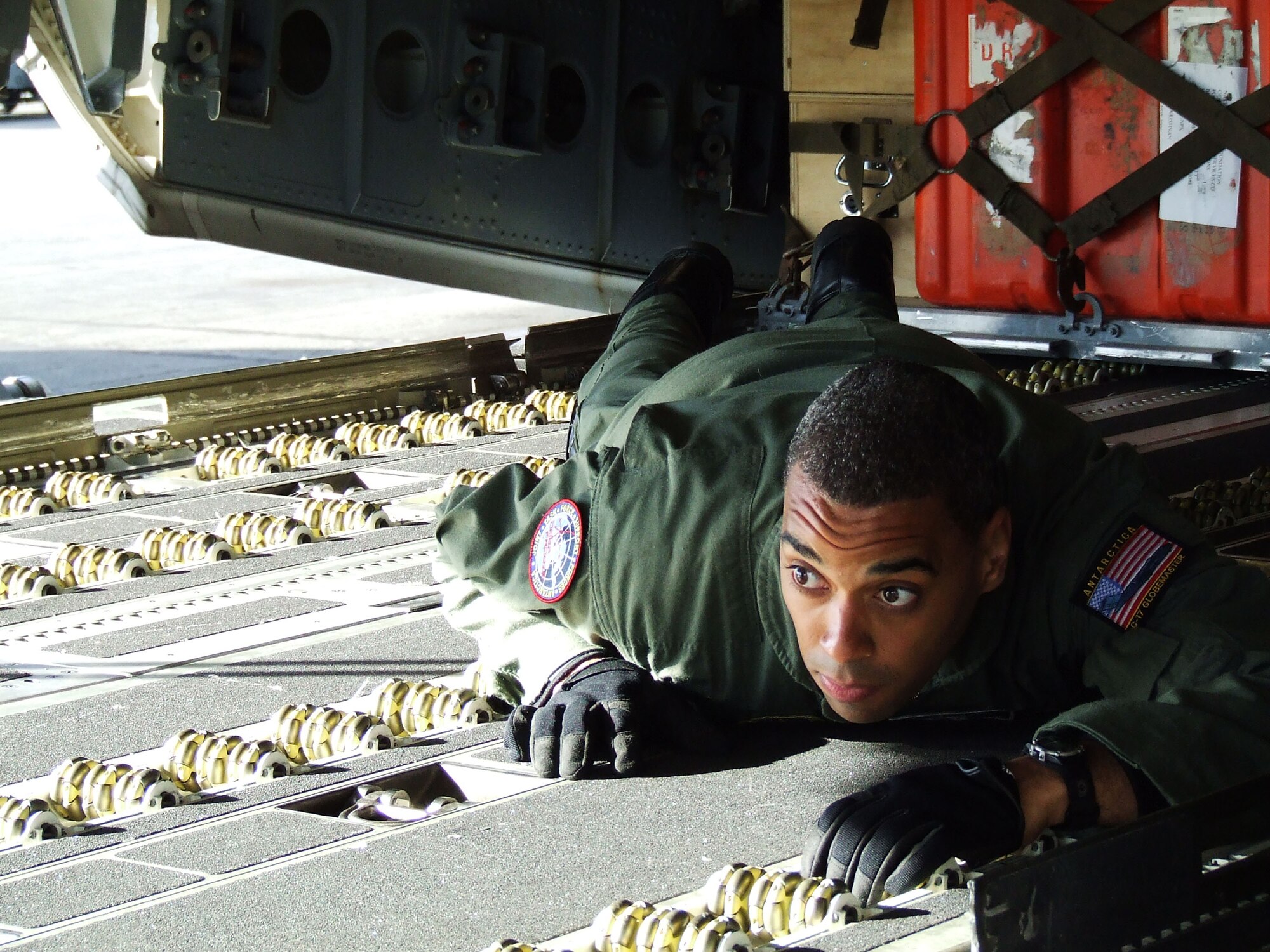 CHRISTCHURCH, New Zealand - Senior Airman Kory Williams, 8th Airlift Squadron, checks the height of a forklift pallet being loaded onto a McChord C-17 Globemaster III Nov. 14, 2006, before it takes off for the ice. U.S. Air Force photo by 1st Lt Erika Yepsen