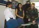 Col. Bill Spacy, 305th Air Mobility Wing vice commander, signs a proclamation Wednesday officially declaring November as McGuire’s Native American Heritage Month as NAH Committee members Catherine Scott (left), 305th Services Squadron, and Georgia Dupuis, 305th Security Forces Squadron, watch.