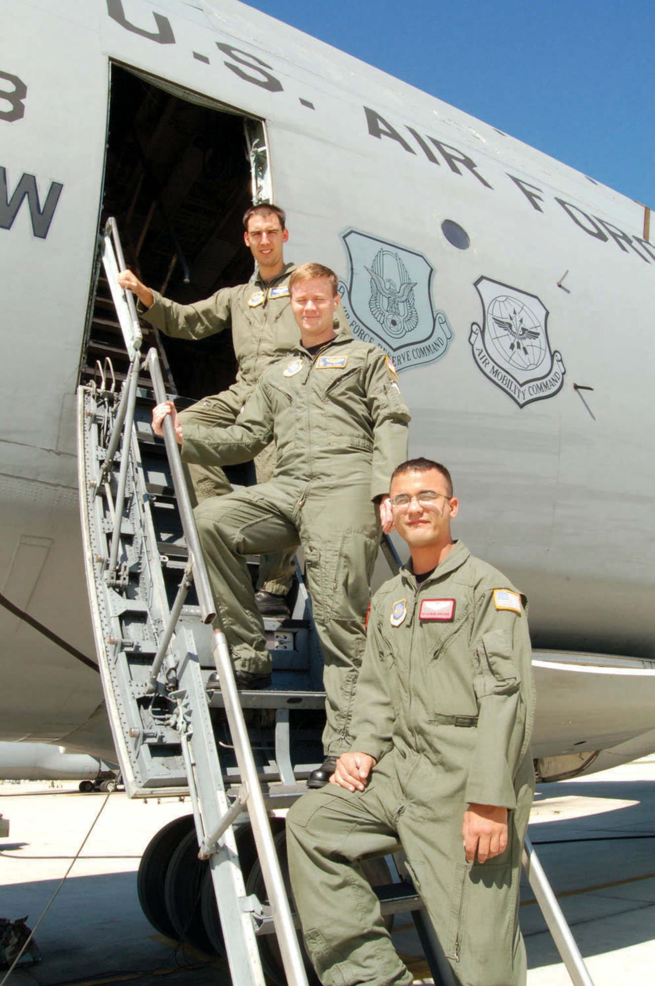 From the top, 1st Lt. Blair Preston, 2nd Lt. Paul Sloan and  Senior Airman Raymond Montanino are the first to graduate from the new C-5 Formal Training Unit Complex at Lackland Air Force Base, Texas. Lieutenant Preston and Sloan are pilots, and Airman Montanino is a flight engineer. (U.S. Air Force photo/Master Sgt. Collen McGee)