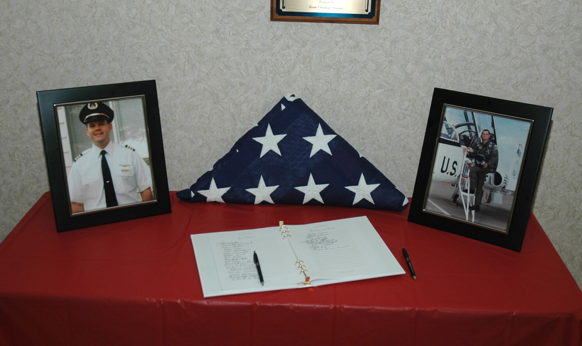 A table displaying pictures of Maj. Todd Humble was the center piece at Maj. Humble's memorial service. (Photo by Master Sgt. Tom Crawford)