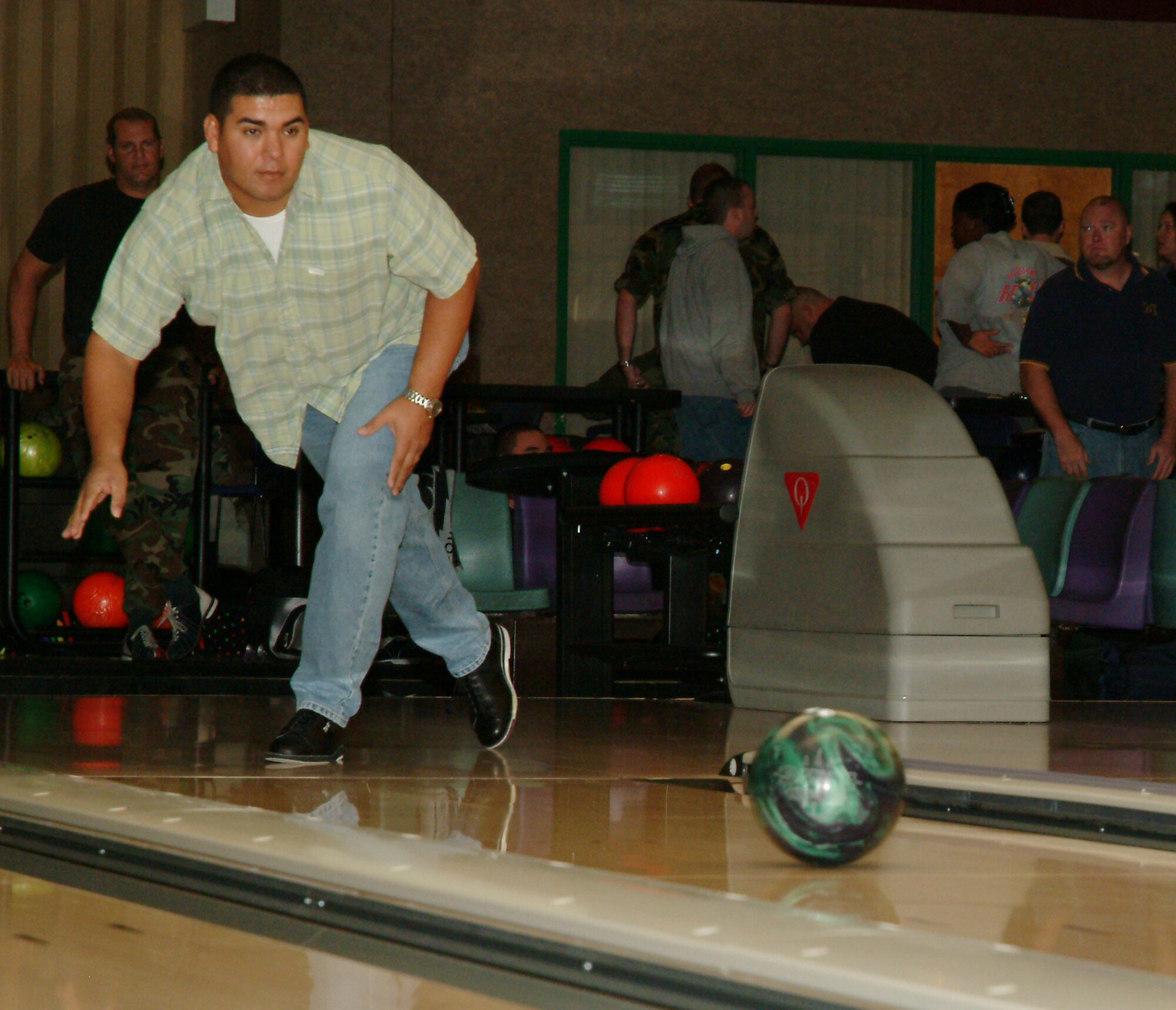 Tech. Sgt. Michael Cruz, 53d Manpower office, shows perfect bowling form at the 53d’s CFC finale  bowling fundraiser Nov. 3. (Photo by Tech. Sgt. Andrew Leonhard.)