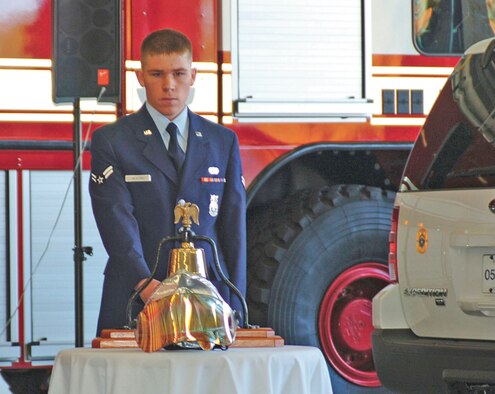 Airman 1st Class Garrett Heaton, 4th Civil Engineer Squadron, rings the fire bell nine times during the new fire station?s ribboncutting ceremony Monday. Firefighters maintain traditions existing for more than 200 years and one of these traditions is the sounding of a bell.  As firefighters began their tour of duty, the bell signals the start of that day?s shift.  Throughout the day and night, each alarm was sounded by a bell, which summoned brave souls to fight fires and placed their lives in jeopardy for the good of their fellow citizen.  After the fire was out and the alarm ended, the bell signaled the completion of that call.  When a firefighter died in the line of duty, paying the supreme sacrifice, it was the mournful toll of the bell that solemnly announced a comrade's passing. These traditions reflect honor and respect to those who have given so much and who have served so well. It symbolizes the devotion that these brave souls had for their duty.  A special signal of three rings, three times each, represented the end of our comrades? duties and that they would be returning to quarters.  (U.S. Air Force photo by Senior Airman Micky Bazaldua)