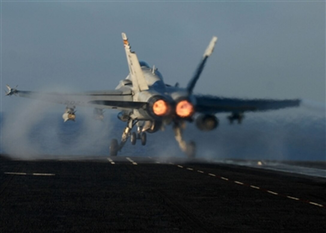 A Navy F/A-18C Hornet aircraft launches from the flight deck of the aircraft carrier USS John C. Stennis (CVN 74) as the ship conducts flight operations in the Pacific Ocean on Nov. 15, 2006.  Stennis is serving as the flagship for Commander, Carrier Strike Group 3 in a joint task force exercise off the coast of southern California.  