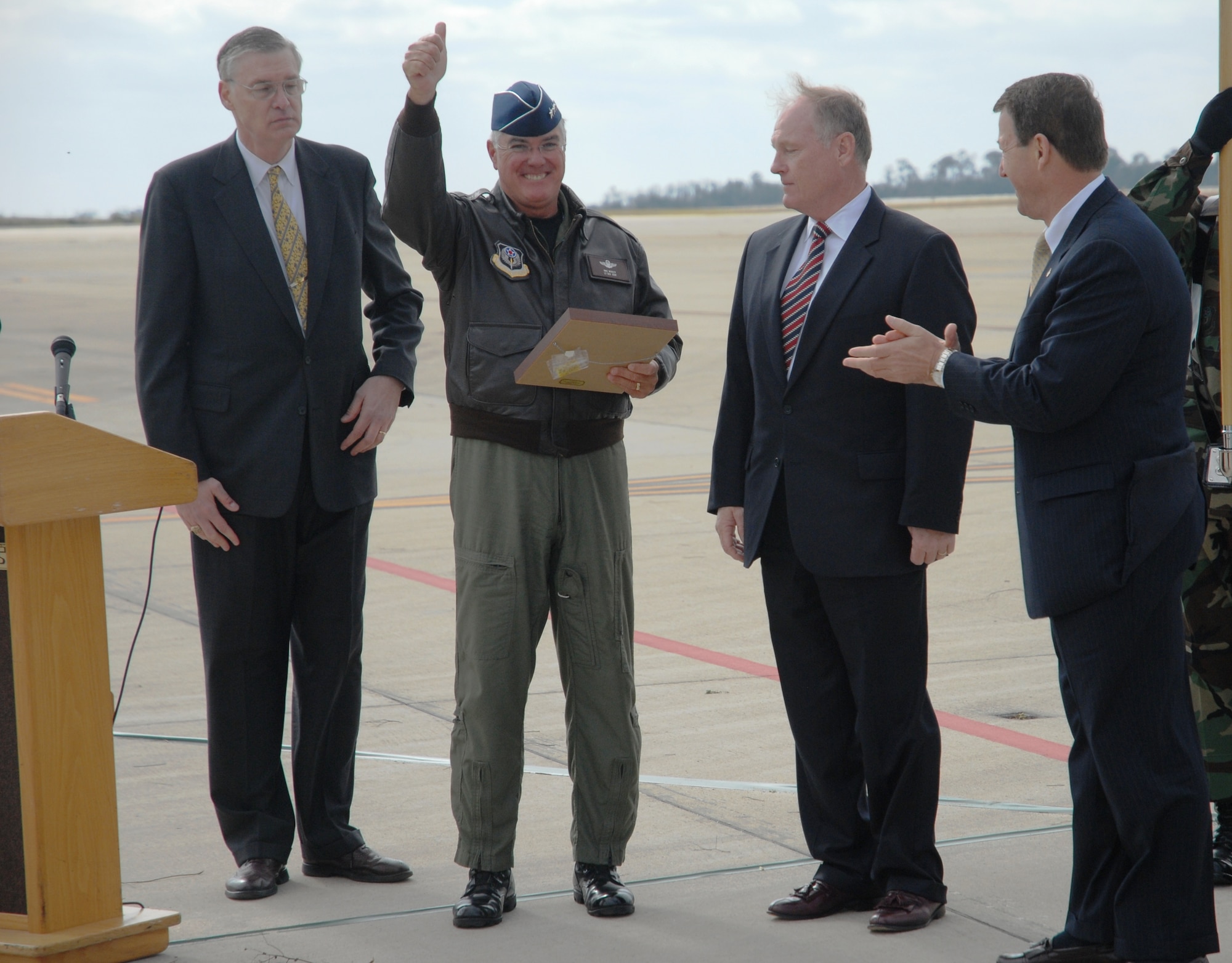 Lt. Gen. Michael W. Wooley, commander of Air Force Special Operations Command, gives the crowd a thumbs-up after receiving the ceremonial “key” to the first CV-22 Osprey at Hurlburt Field, Fla., on Nov 16.  Gen. Wooley piloted the CV-22 to Air Force Special Operations Command’s Air Force 60th Anniversary commemoration.