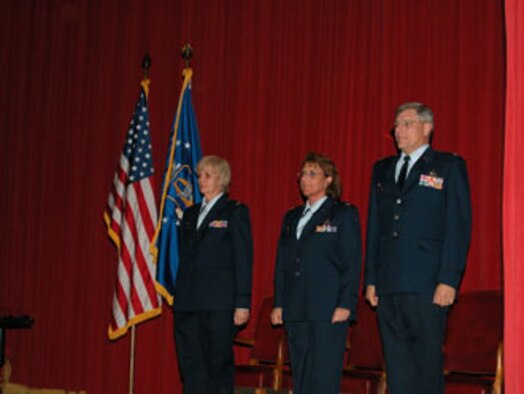Col. Pamela LeBlanc (left) officiated the Change of Command Ceremony at March Air Reserve Base where Lt. Col. Tanya A. Porter (center) assumed command of the 56th Aerial Port squadron from Lt. Col. Laurence B. Harris (right). (USAF photo by Staff Sgt. Joe Davidson, 452 AMW Public Affairs)