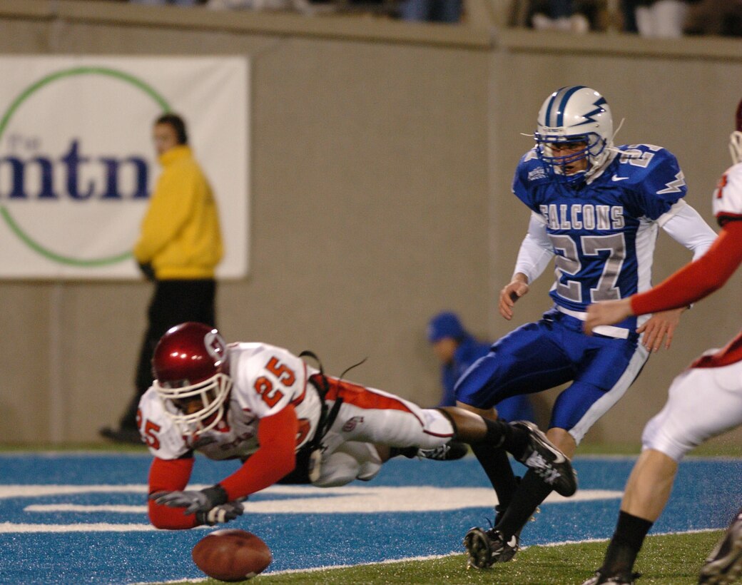 Utah special teams player R.J. Stanford dives to down a Louie Sakoda punt inches away from the Falcon goal line to pin the Air Force deep in its own territory Nov. 18 in Colorado Springs, Colo. The hardship was short-lived for the Falcons as quarterback Shaun Carney found receiver Mark Root two plays later for 31 yards. The Utes won the game 17-14 with a Sakoda field goal as the clock ran out. (U.S. Air Force photo/1st Lt. John Ross) 
